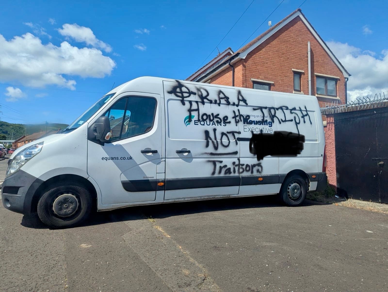 CONDEMNATION: The racist graffiti on a Housing Executive van