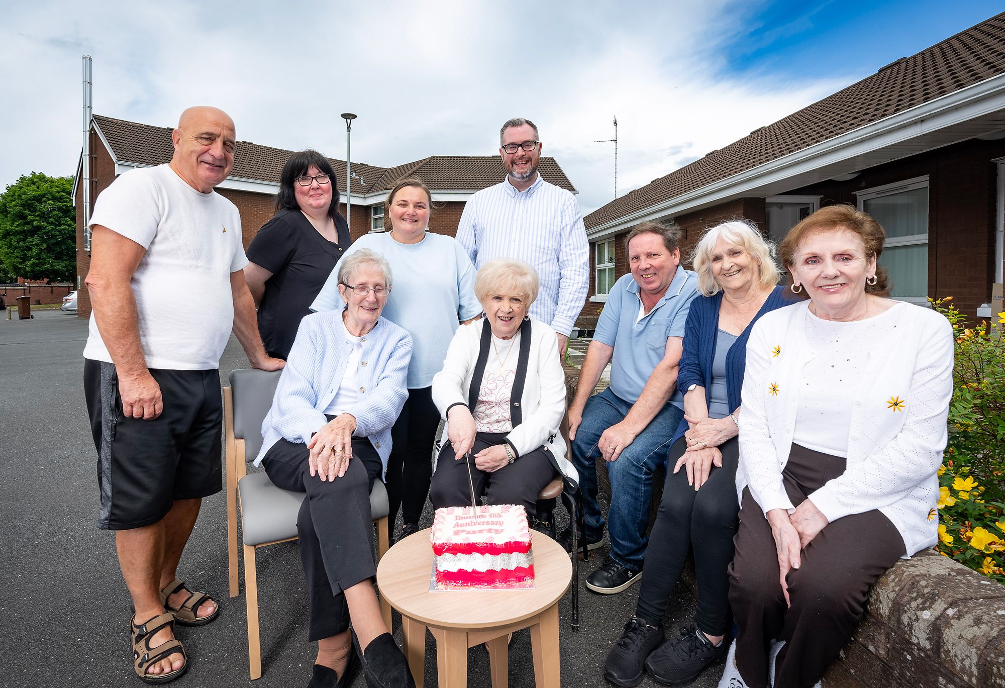 TOGETHER: Choice Housing staff and Lime Court residents celebrate the schemes 40th anniversary