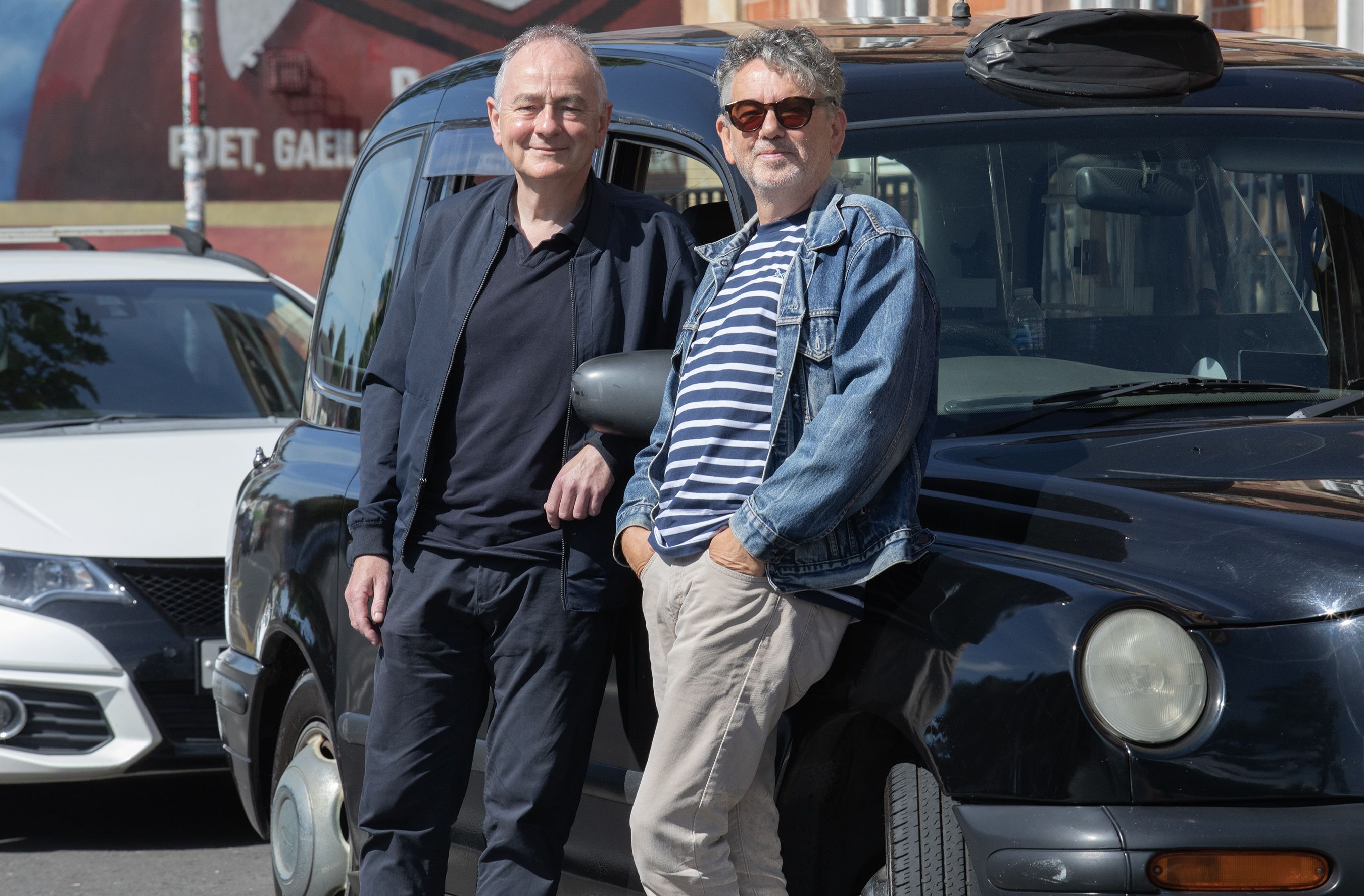 CATCH A BLACK HACK: Noel Burke and Kevin O\'Neill on familiar ground on Belfast\'s Falls Road