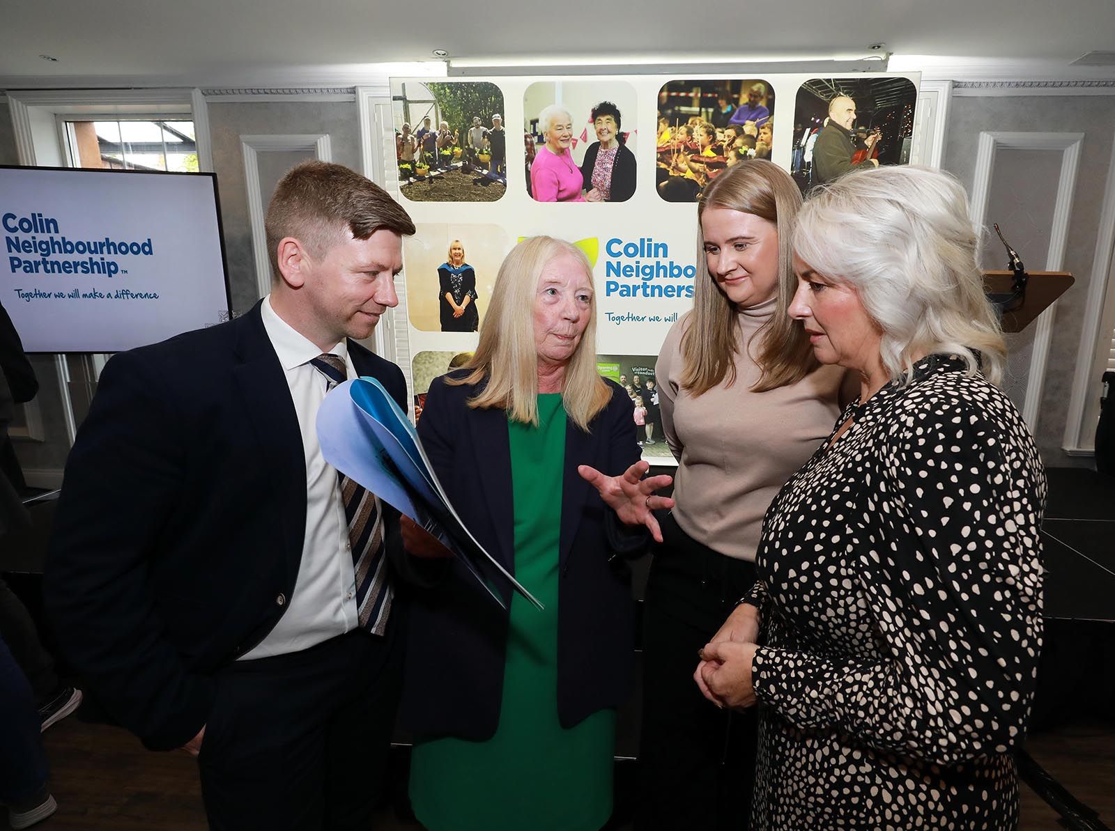 VISION: Chairperson Michael Cooper and Partnership Manager Annie Armstrong show CNP's Strategic Plan to Junior Ministers Aisling Reilly MLA and Pam Cameron MLA