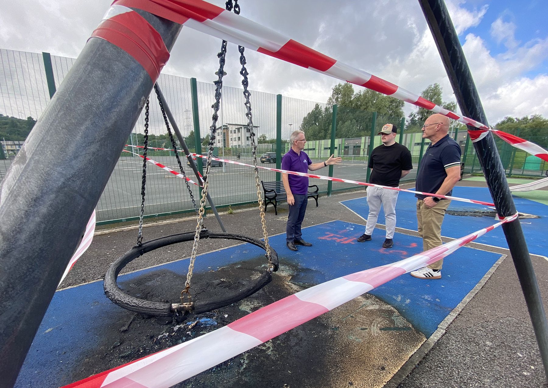 OUT OF ACTION: Martin Connolly from Sally Gardens with Cllr Caoimhín McCann and West Belfast MP Paul Maskey