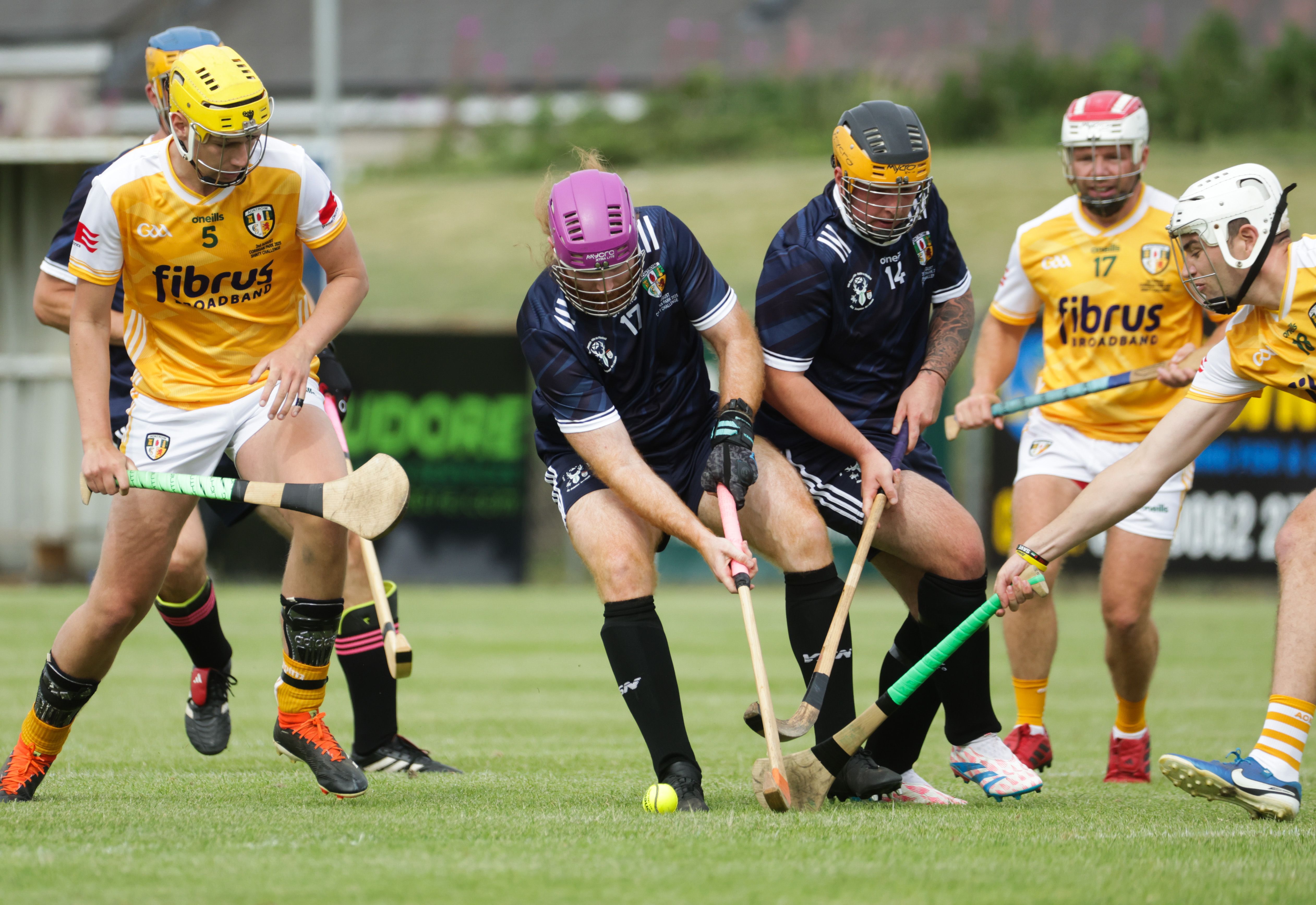 GETTING STUCK IN: Action from the men\'s match on Saturday
