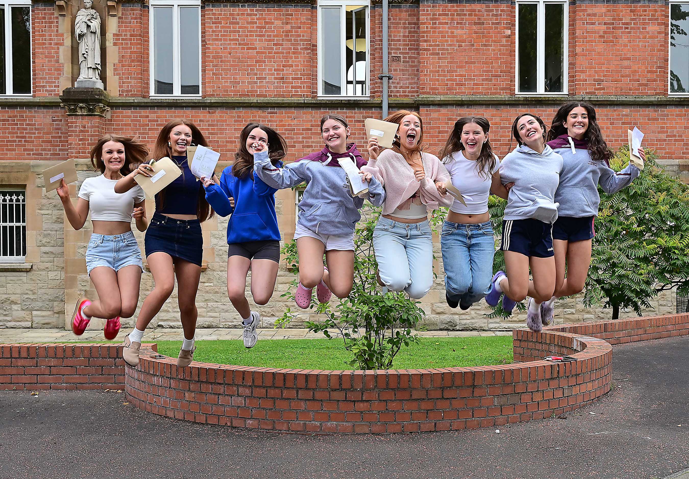 JUMP FOR JOY: St Dominic\'s pupils celebrate receiving their A Level results