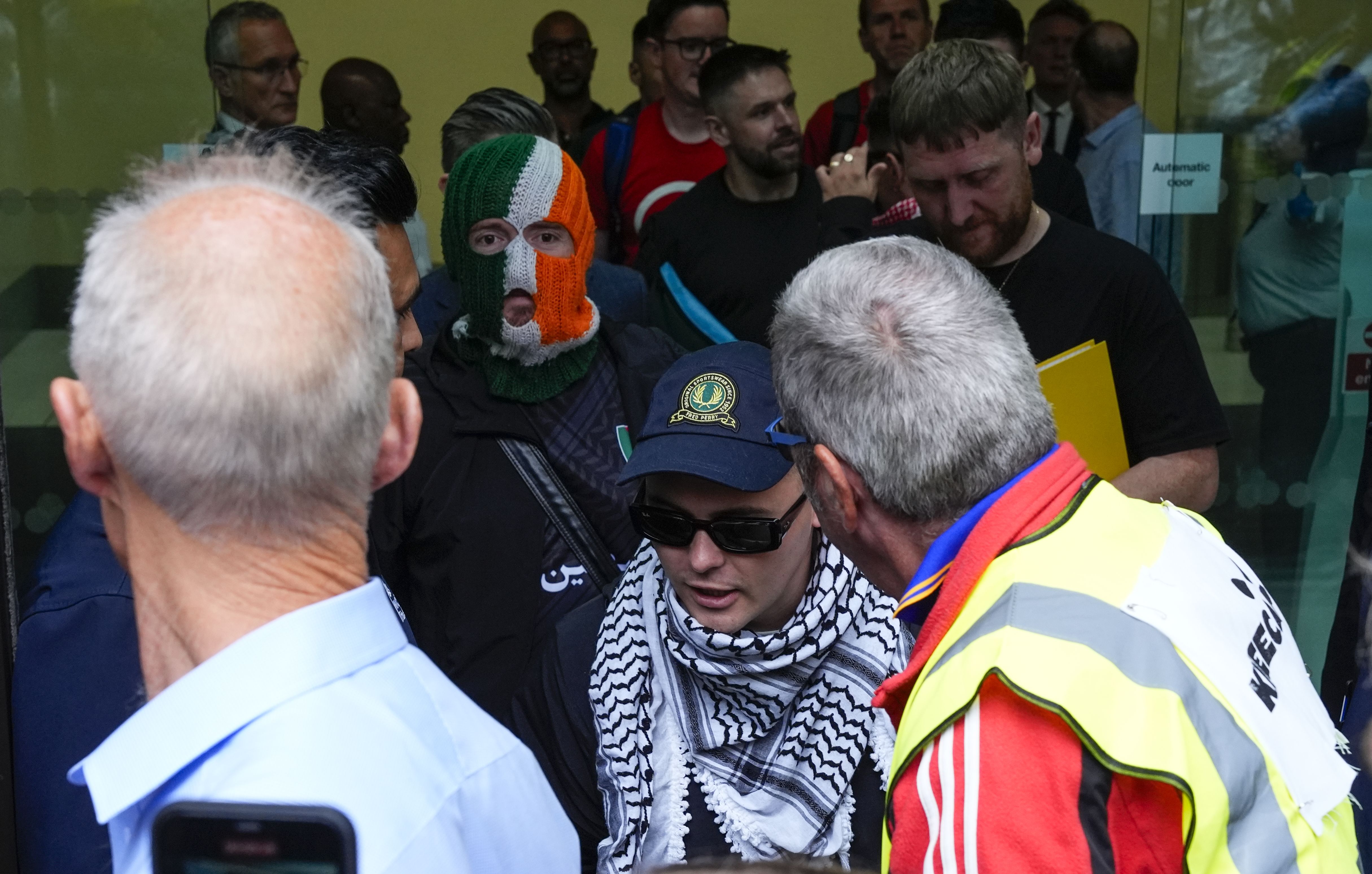 SECOND APPEARANCE: Liam Ó hAnnaidh leaving Westminster Magistrates Court on Wednesday with DJ Provaí