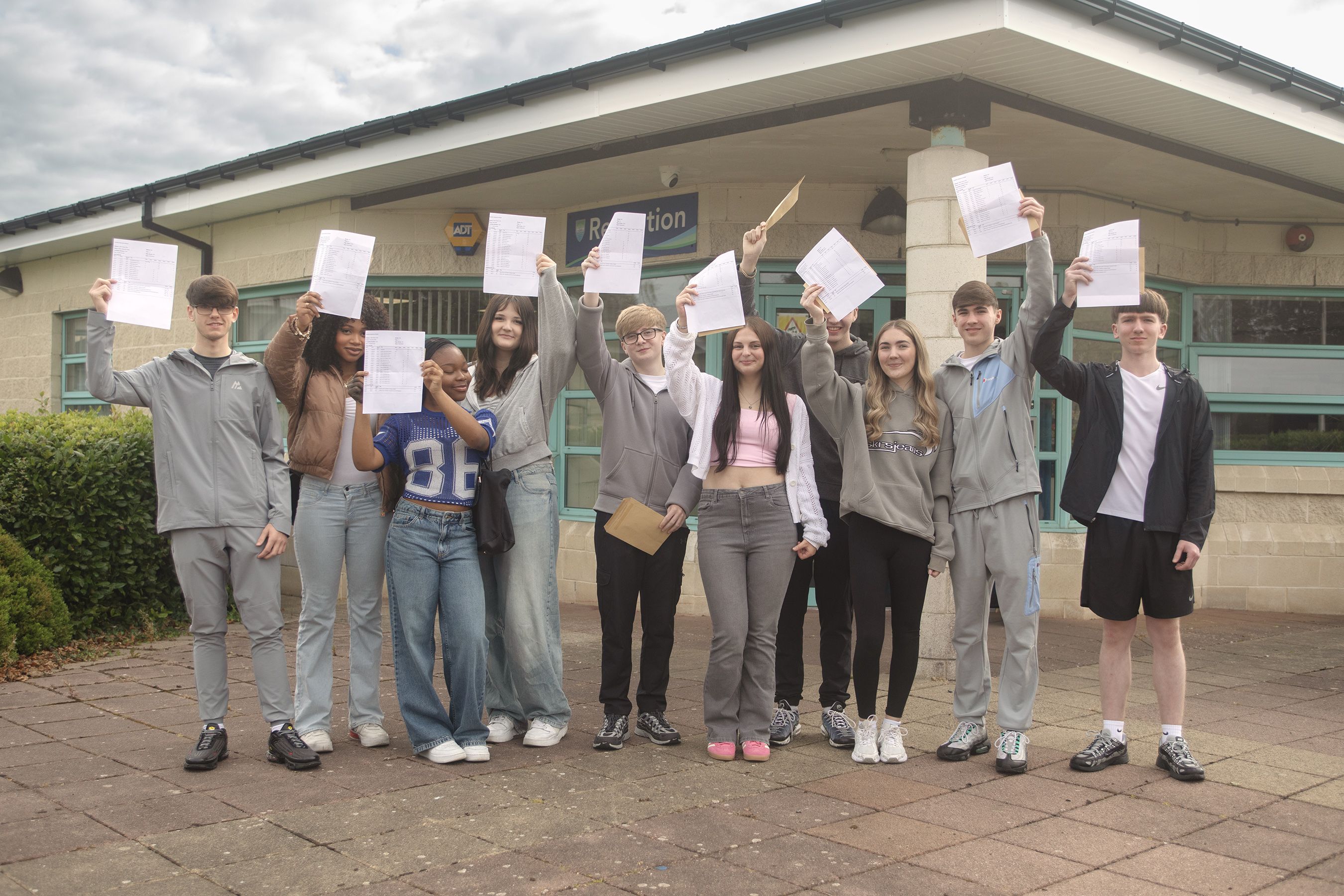 ONWARDS AND UPWARDS: Pupils at Malone College in Finaghy celebrate their GCSE results today