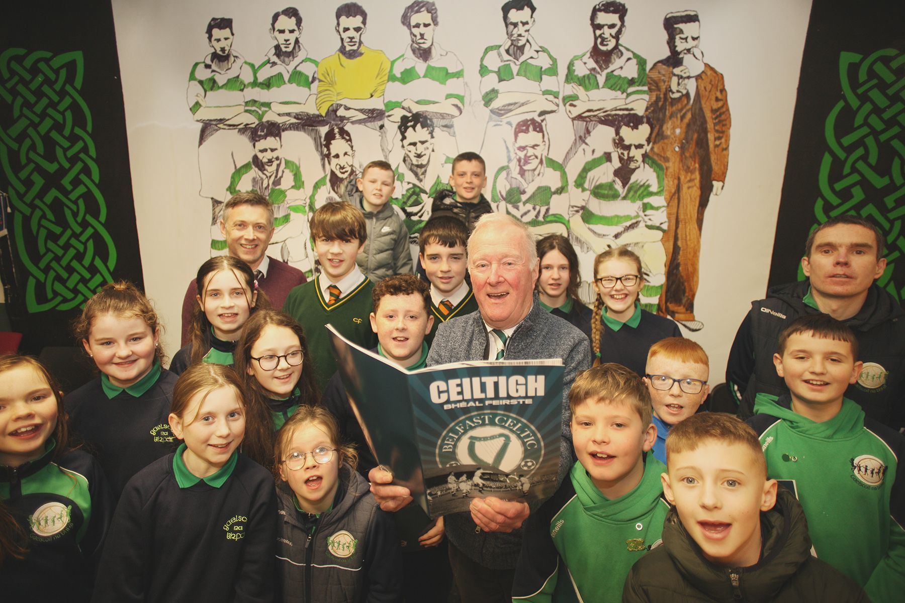 FÁILTE: Seán Fennell, right, Charlie Tully, centre, and schoolchildren from Gaelscoil na bhFál visiting the Belfast Celtic Museum