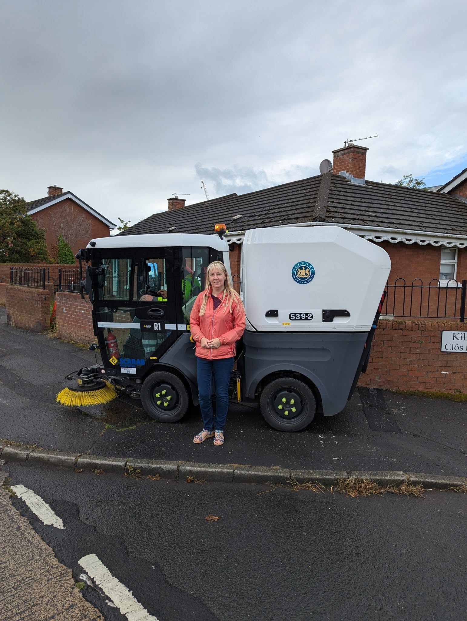 WELCOME: Sinn Féin councillor Claire Canavan with one of the new machine that’s sweeping the Falls