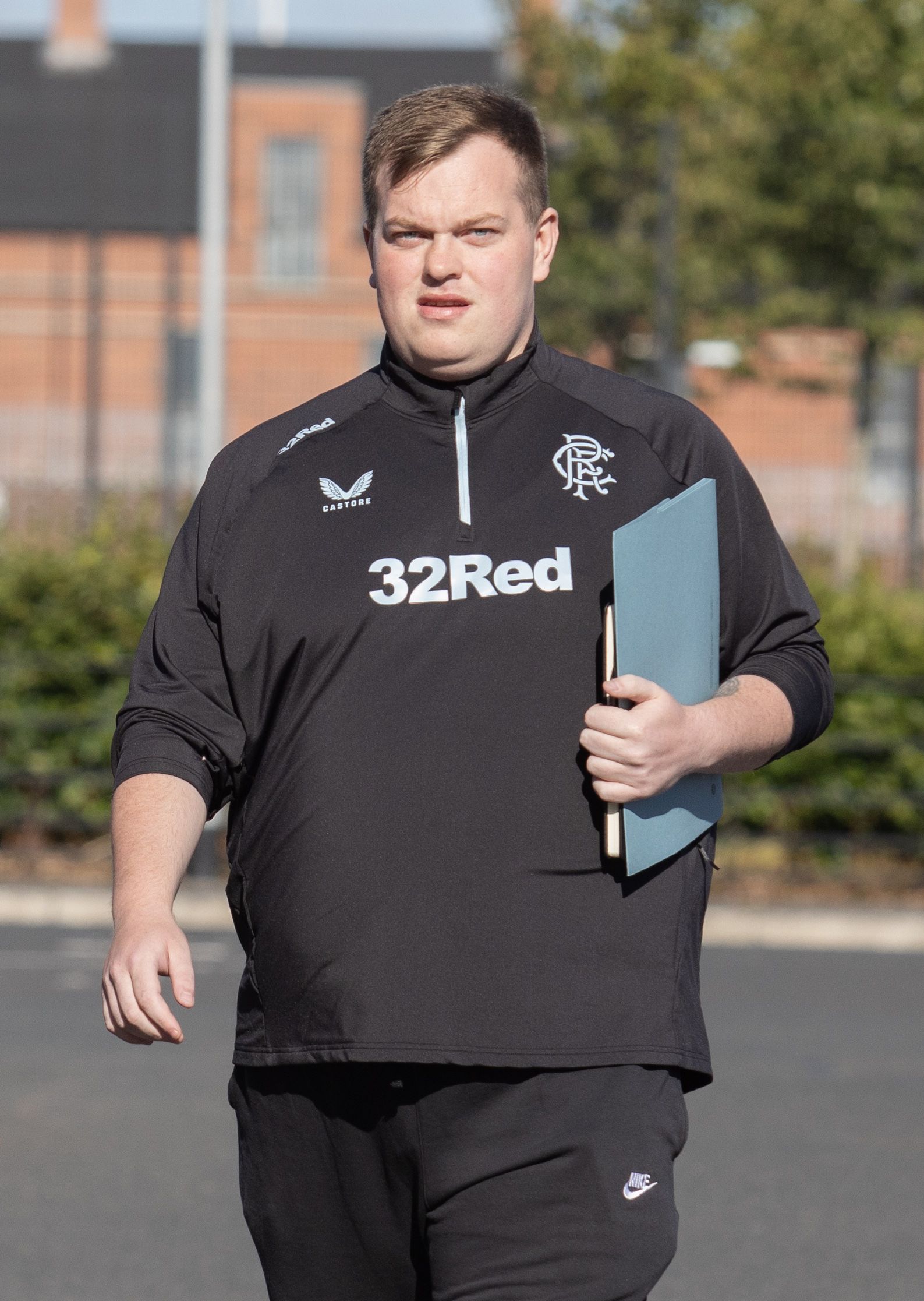 CAUSING A STIR: The DUP\'s Cllr Jordan Doran wears a Rangers top into Tuesday\'s interface meeting at Girdwood on housing intimidation 