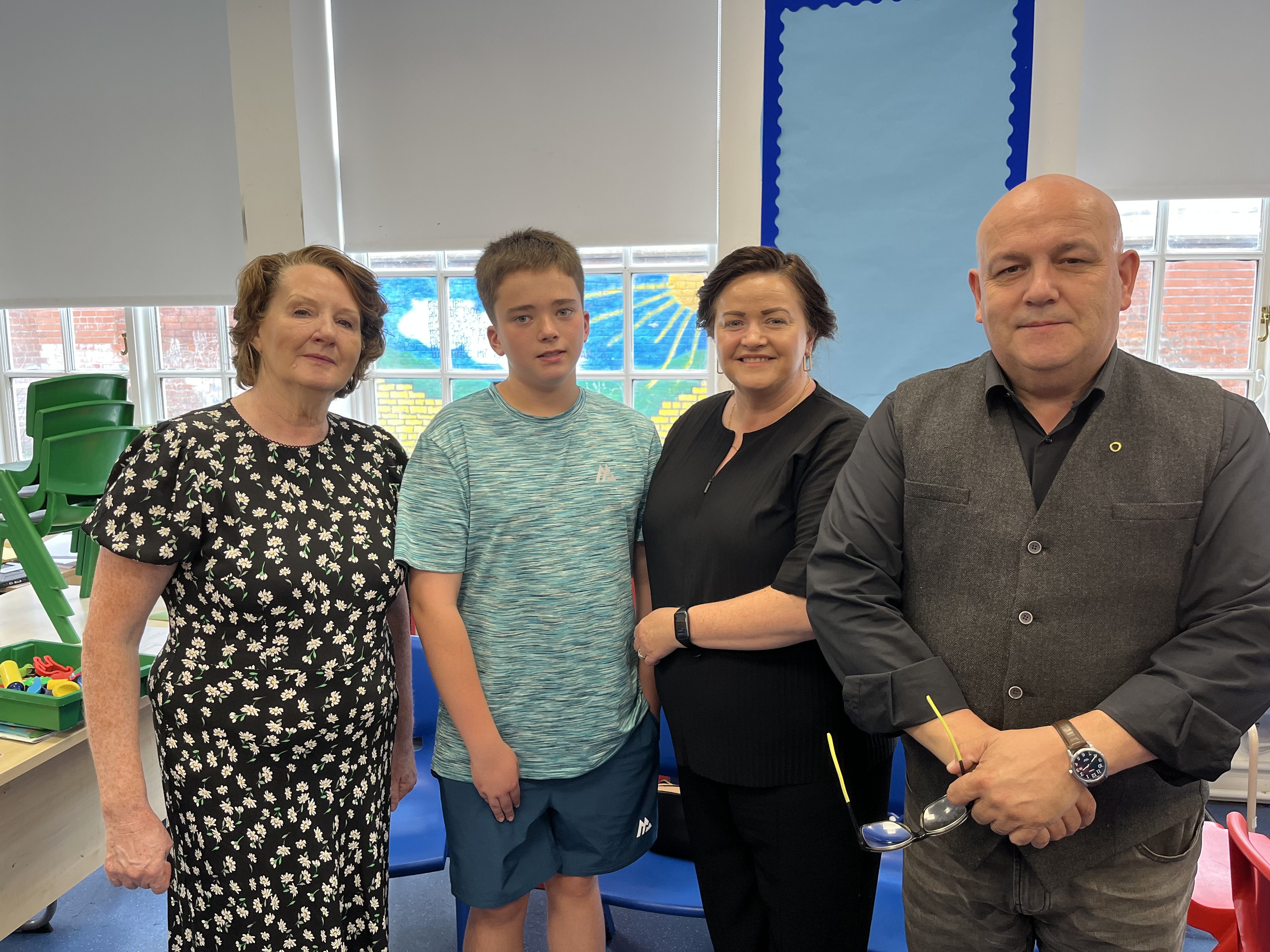 IN MEMORY: Maighréad Armstrong (Secretary) with Brian’s former pupil Ché Duffy and mum Andrea Duffy and Bunscoil Mhic Reachtain Principal Séamas Ó Donnghaile