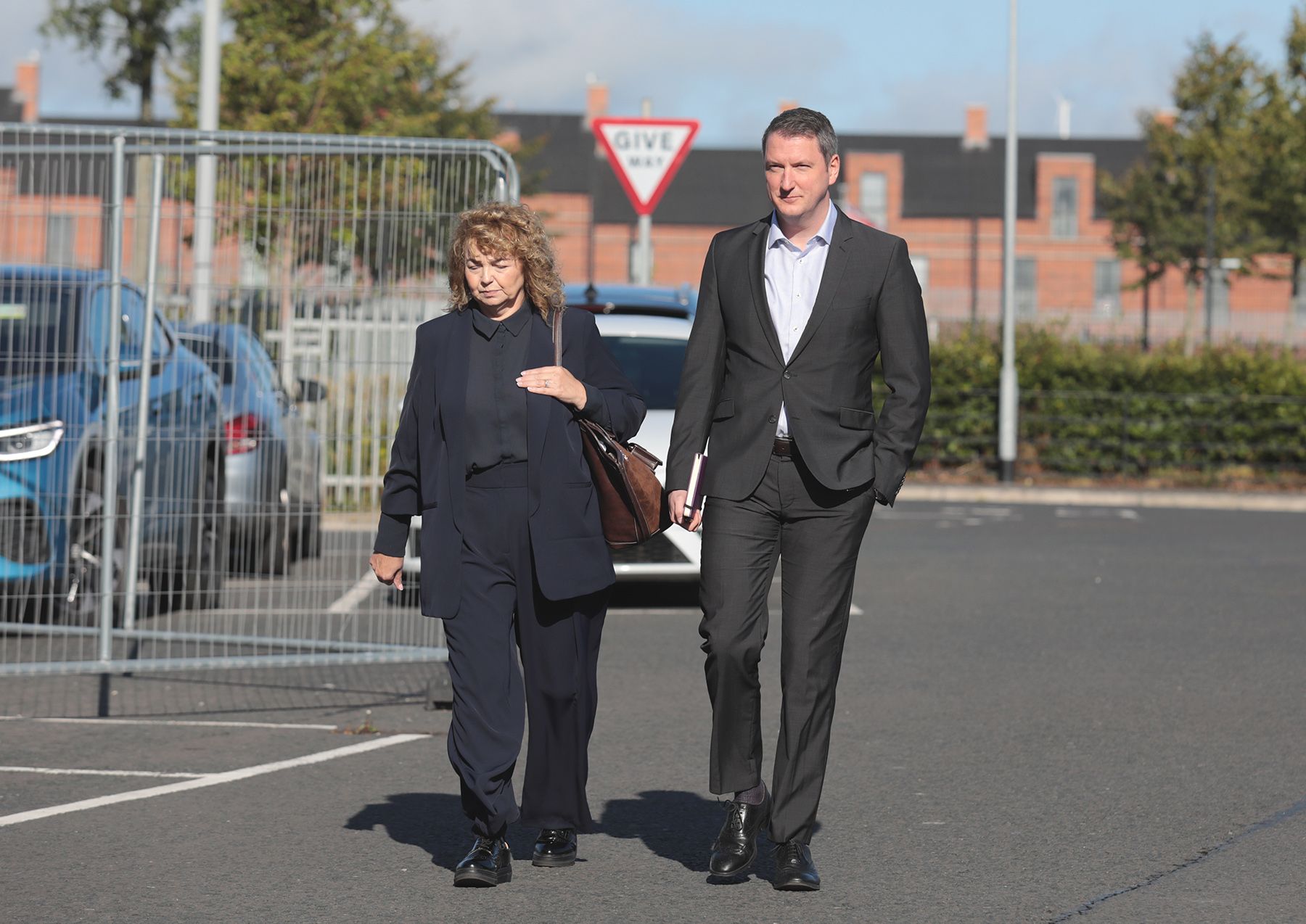 MEETING: Carál Ní Chuilín MLA and John Finucane MP arrive for the meeting at Girdwood Community Hub on Tuesday