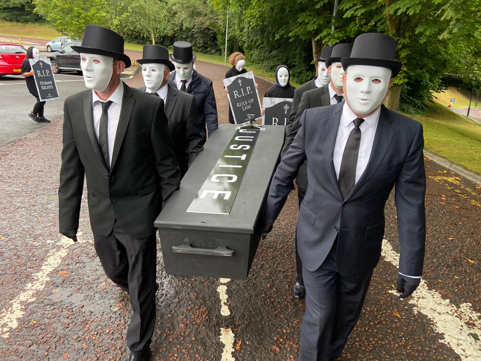 SILENT PROTEST: Victims\' families carried the coffin of \'justice\' at a symbolic 2021 event