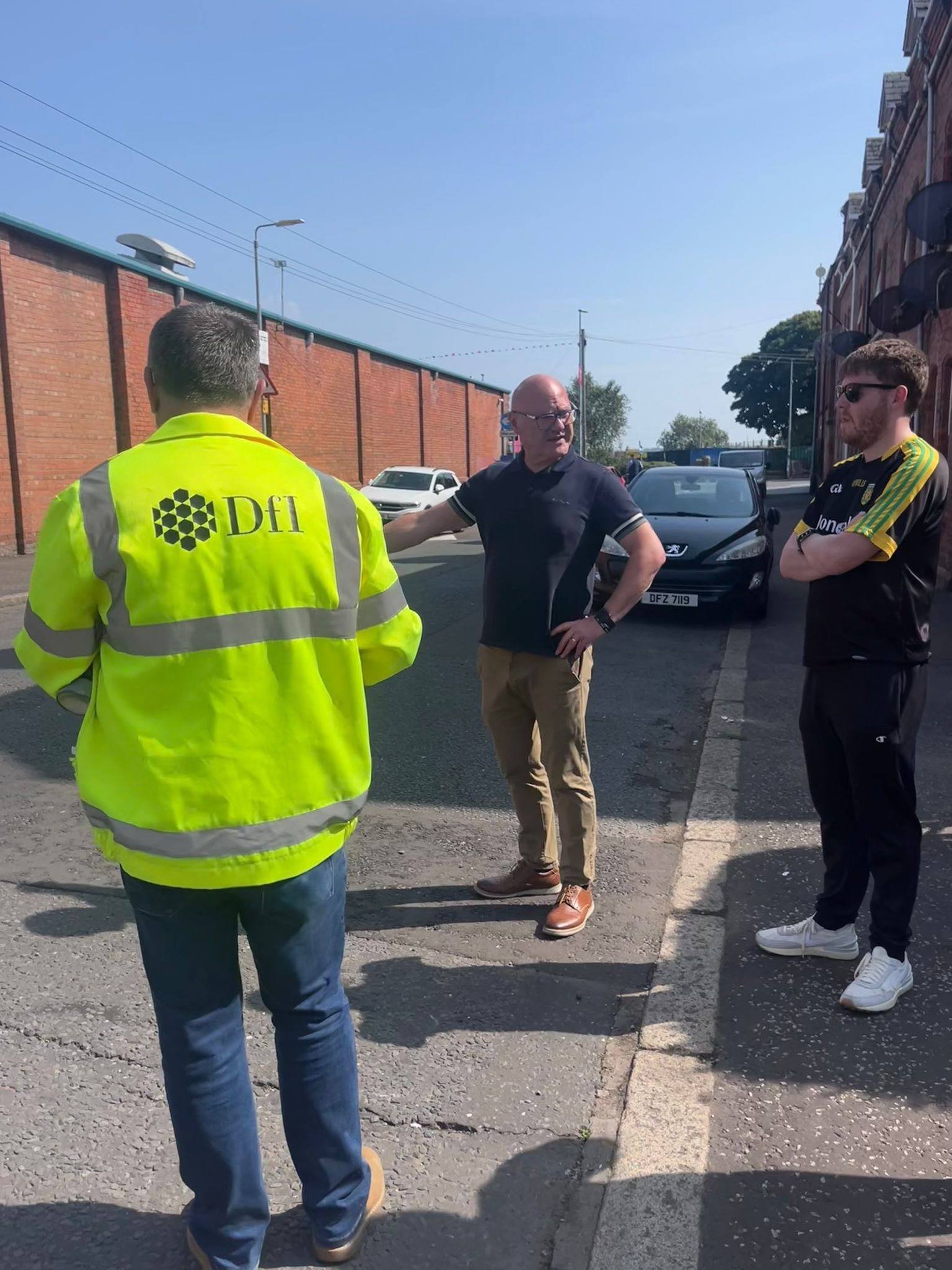 POTHOLE REPAIRS: Paul Maskey MP and Councillor Ronan McLaughlin in Divis Drive