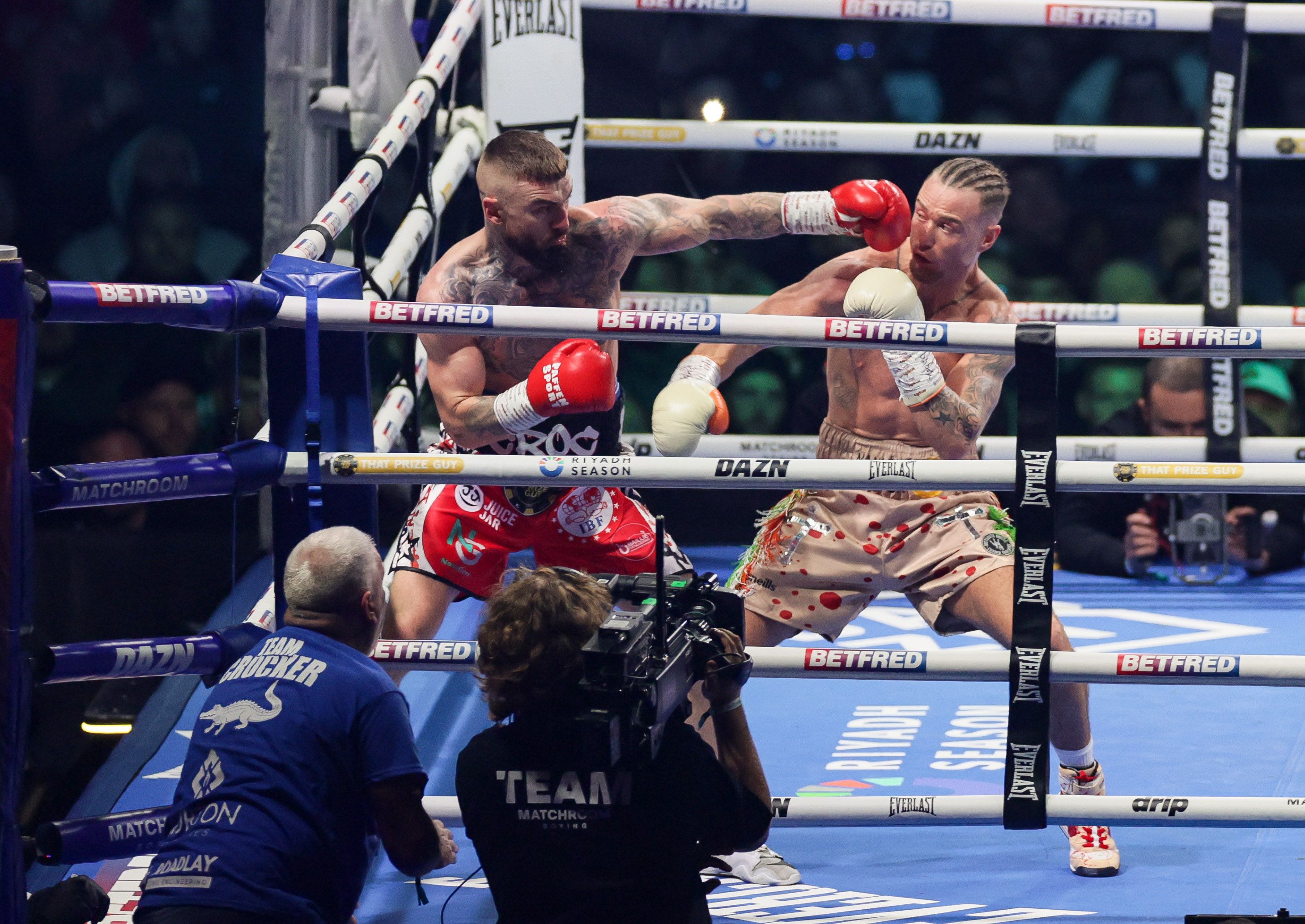 CLOSE CALL: Lewis Crocker snaps out a straight left as Paddy Donovan backs him into a corner