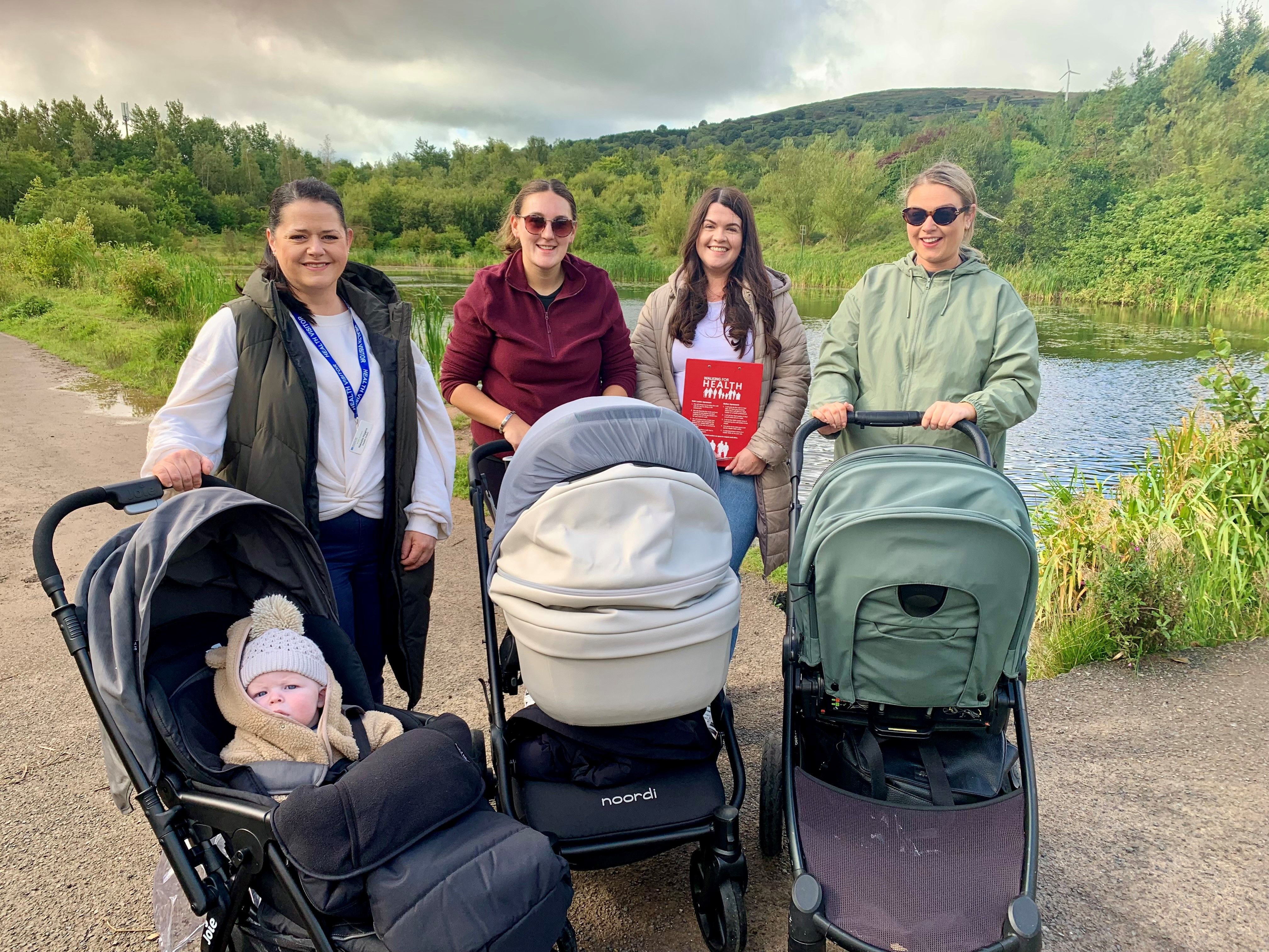 South Eastern Trust Health Visitor Natasha Higgins with little Cónall Stanley, Jacqueline Hyland with daughter Éireann May Hyland, CNPs Early Intervention Support Worker Danielle Hyland and Fionnuala Pimley with her daughter Ría Hawkins