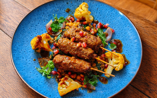 PLATING UP: Spiced lamb skewers on a bed of curry-coated cauliflower