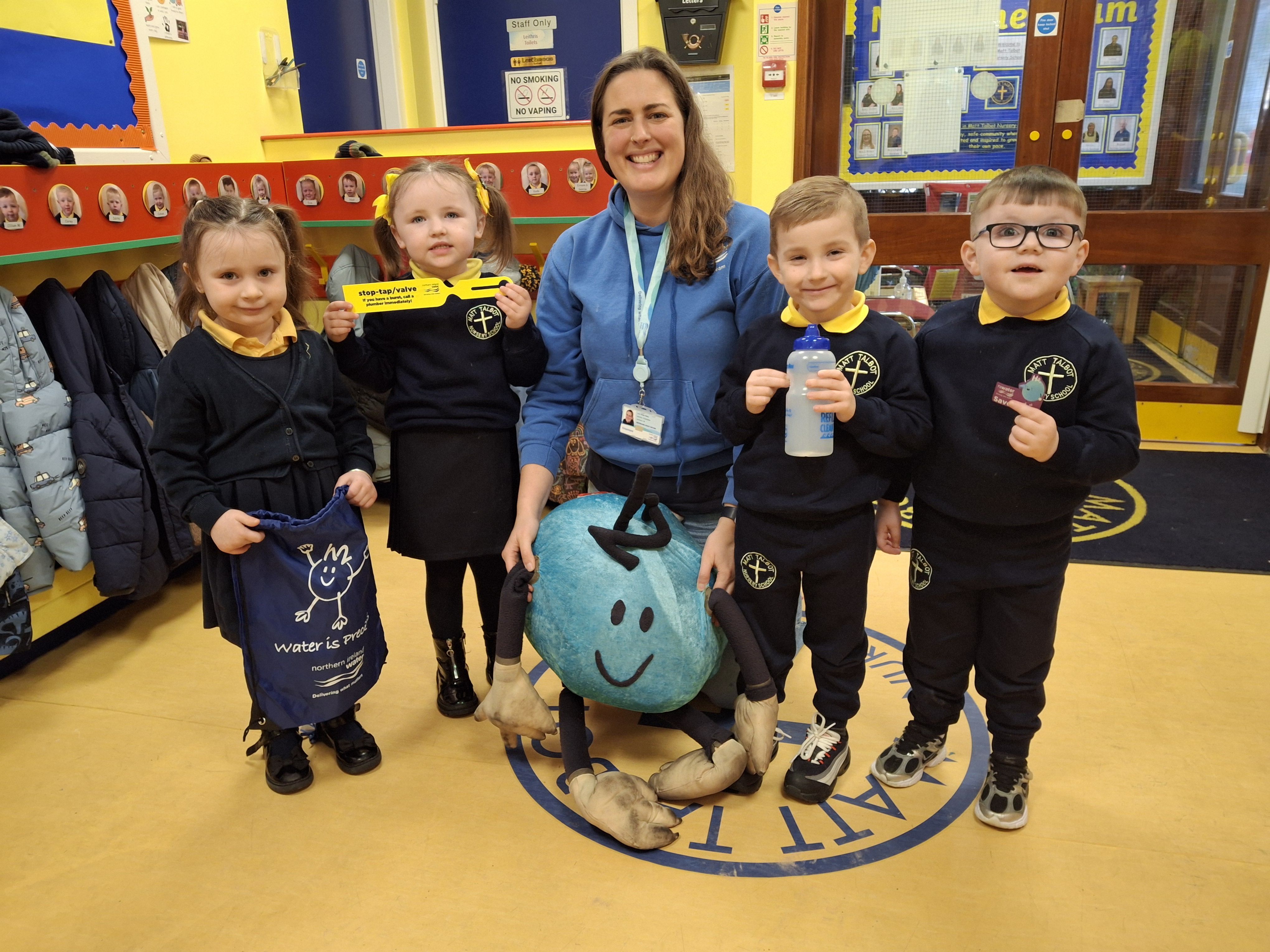 ADVICE: NI Water education officer Anna Killen and NI Water’s raindrop mascot H20 with pupils at Matt Talbot Nursery School