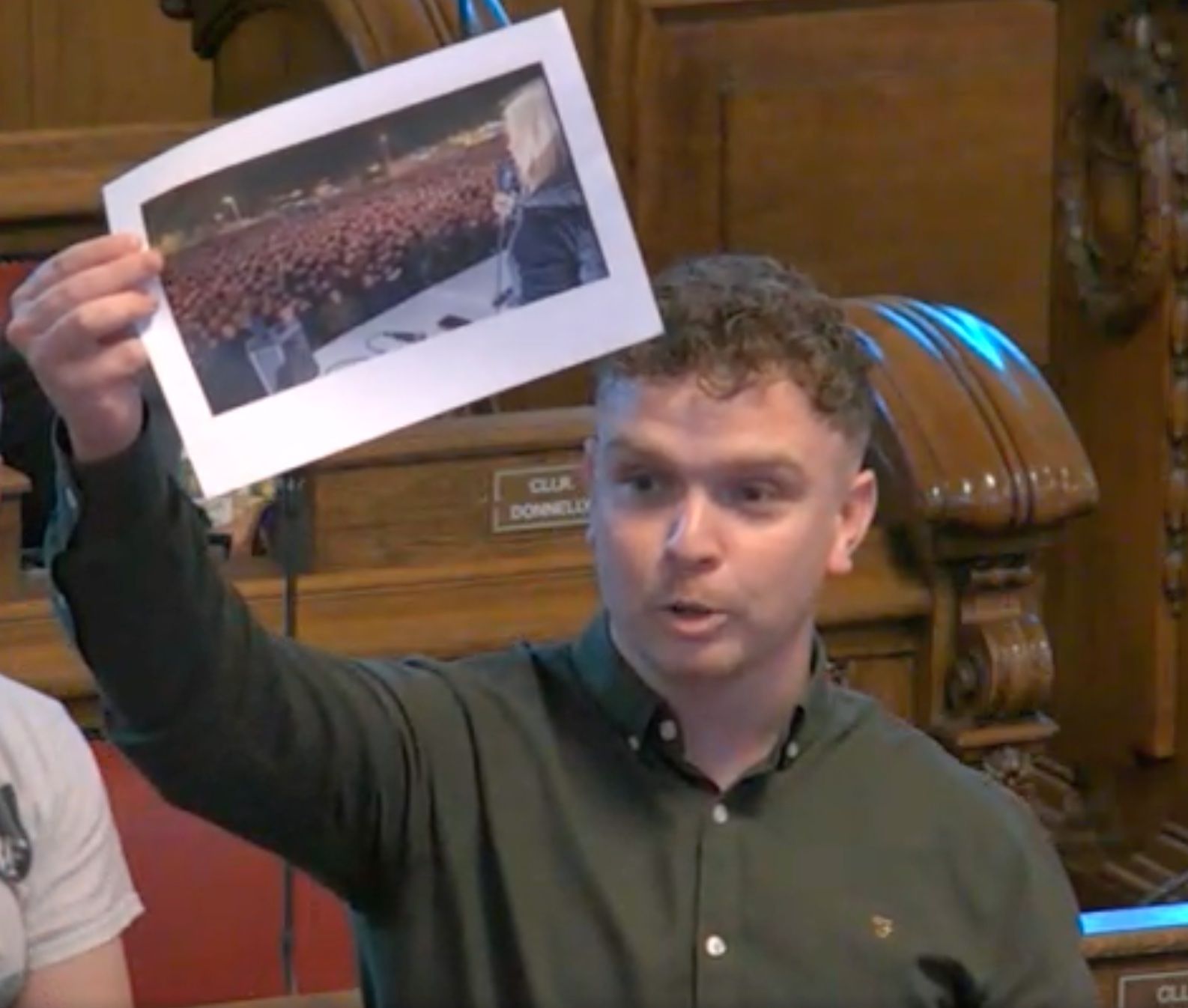 AI IMAGES: Sinn Féin councillor Ryan Murphy with a photo of the AI generated image