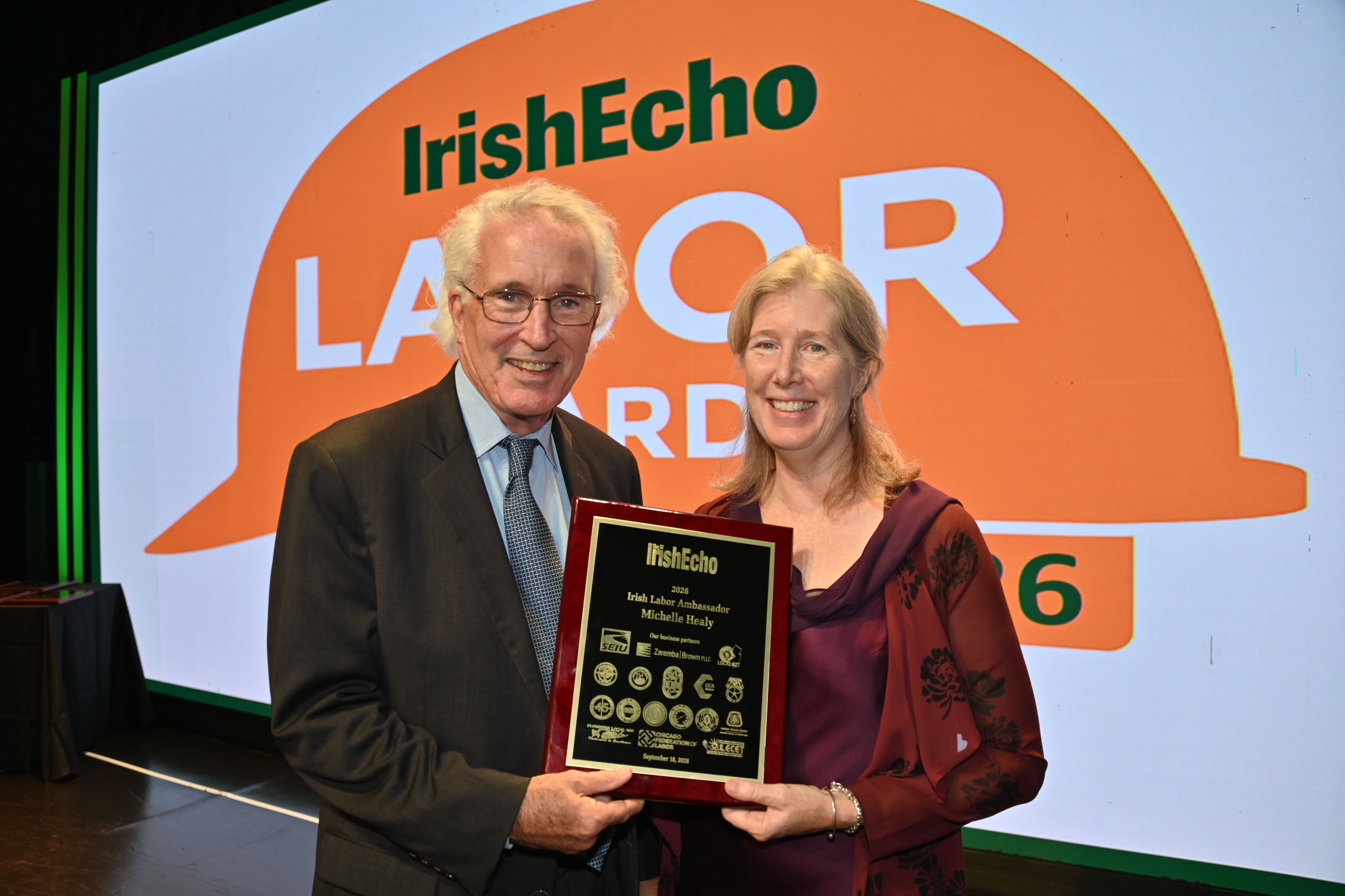 TRIBUTE: Kirk Adams, former chief of staff at the SEIU, presents an Irish Labor Ambassador Award to Michelle Healy of Boston, Director of \'Not With our Money\' and former senior official with SEIU