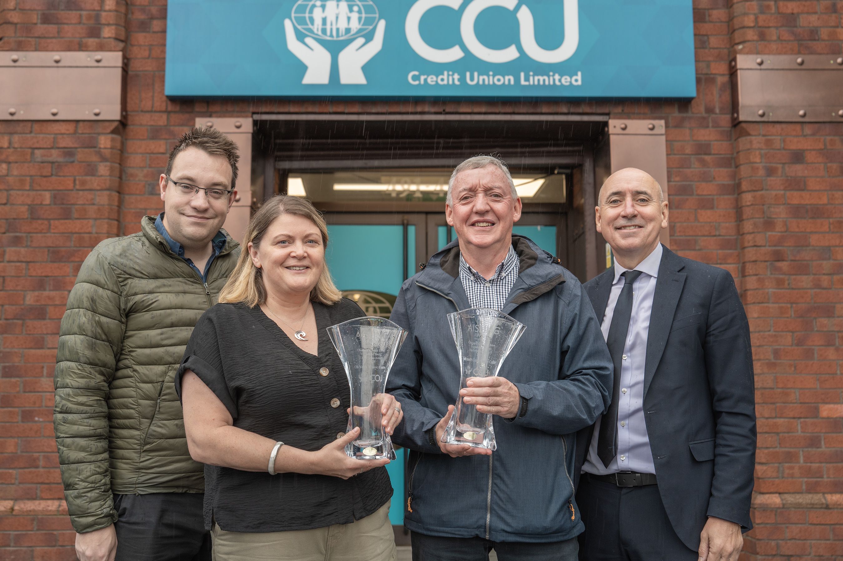 SOCIAL ENTERPRISE AWARD: Conor McParland (Belfast Media) and Terry McCrudden (CCU) with last year\'s winner and special recognition winners, Michael George (Tullymore Community Centre) and Charlotte Dryden (Oh Yeah Centre) 