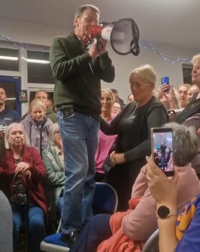 IT\'S OVER: Breandán Mac Cionnaith makes the announcement to the residents of Garvaghy Road this evening
