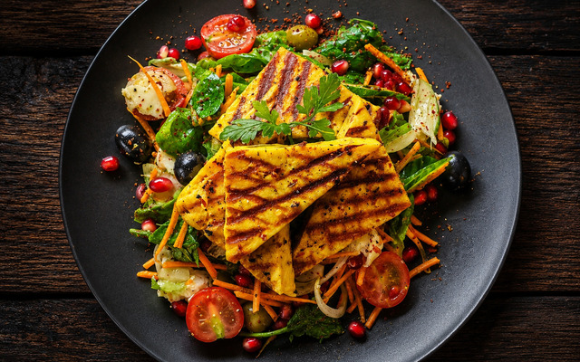 PLATING UP: Grilled paneer with black and green olives and salad