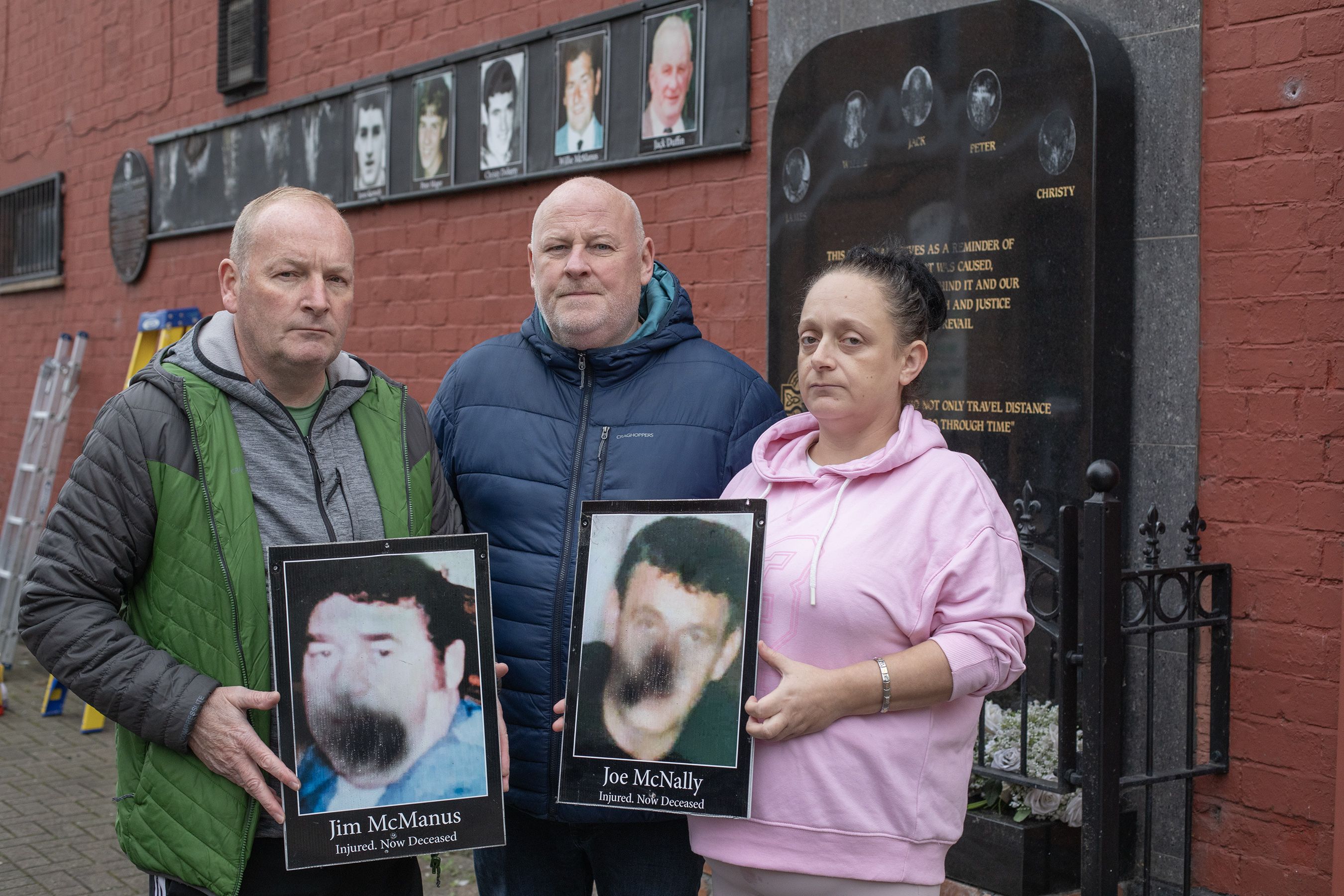 ATTACKED: Billy McManus, Mark Sykes and Tracey McNally with some of the photos that were defaced on Thursday morning