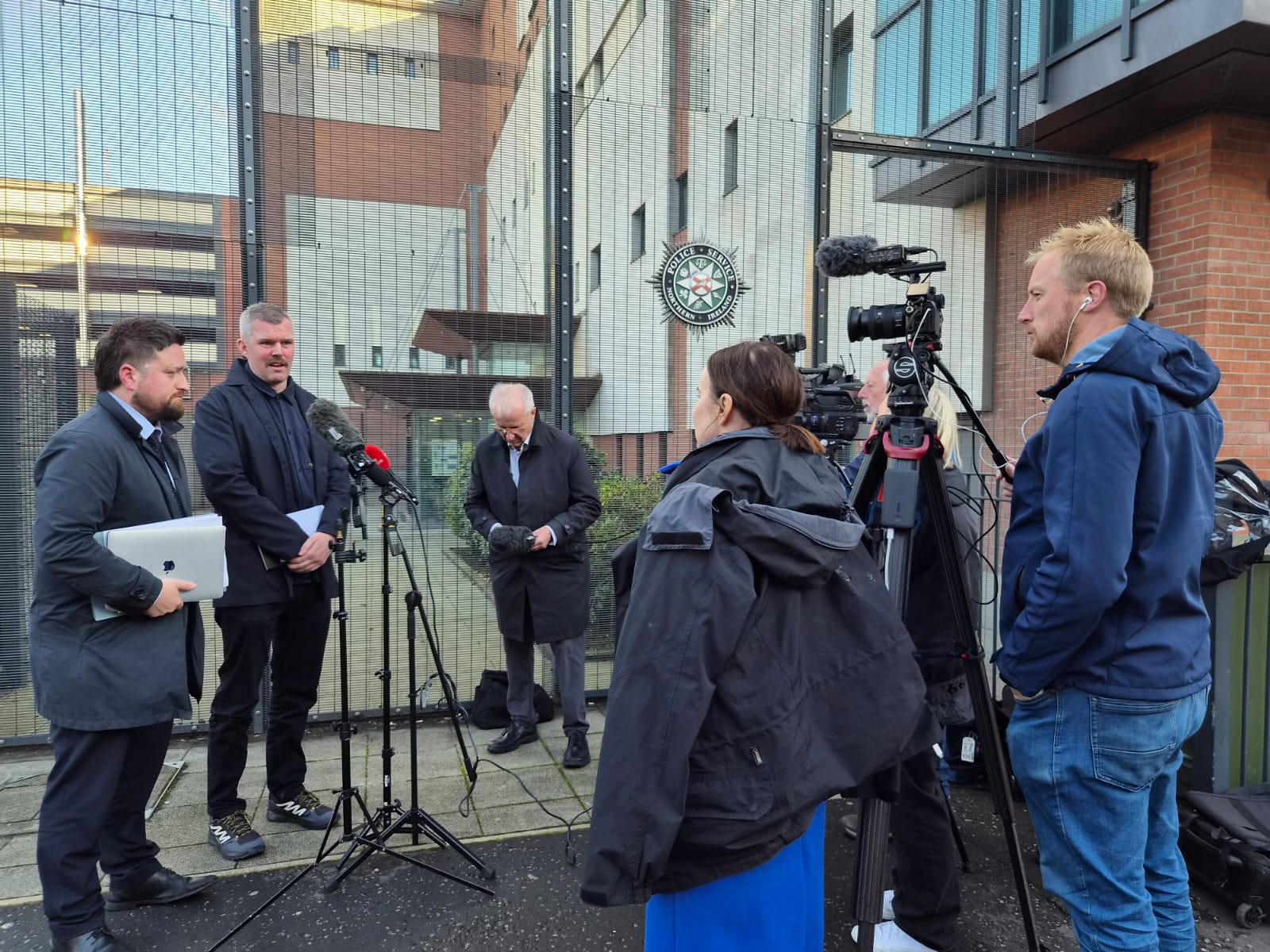 RESOLUTE: Gerry Carroll speaks to the press outside Musgrave PSNI station