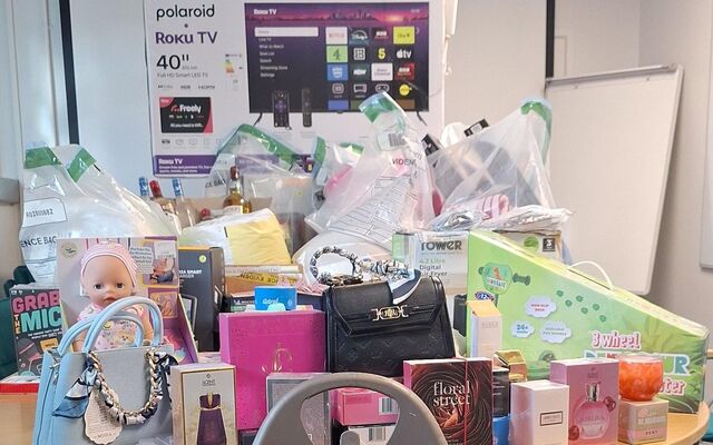 Woman arrested after police seize suspected stolen goods, counterfeit currency and suspected drugs on Falls