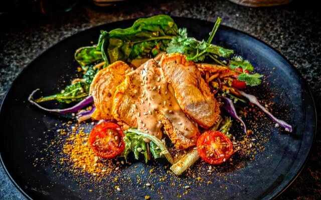 PLATING UP: Spiced succulent Shawarma chicken breast with salad