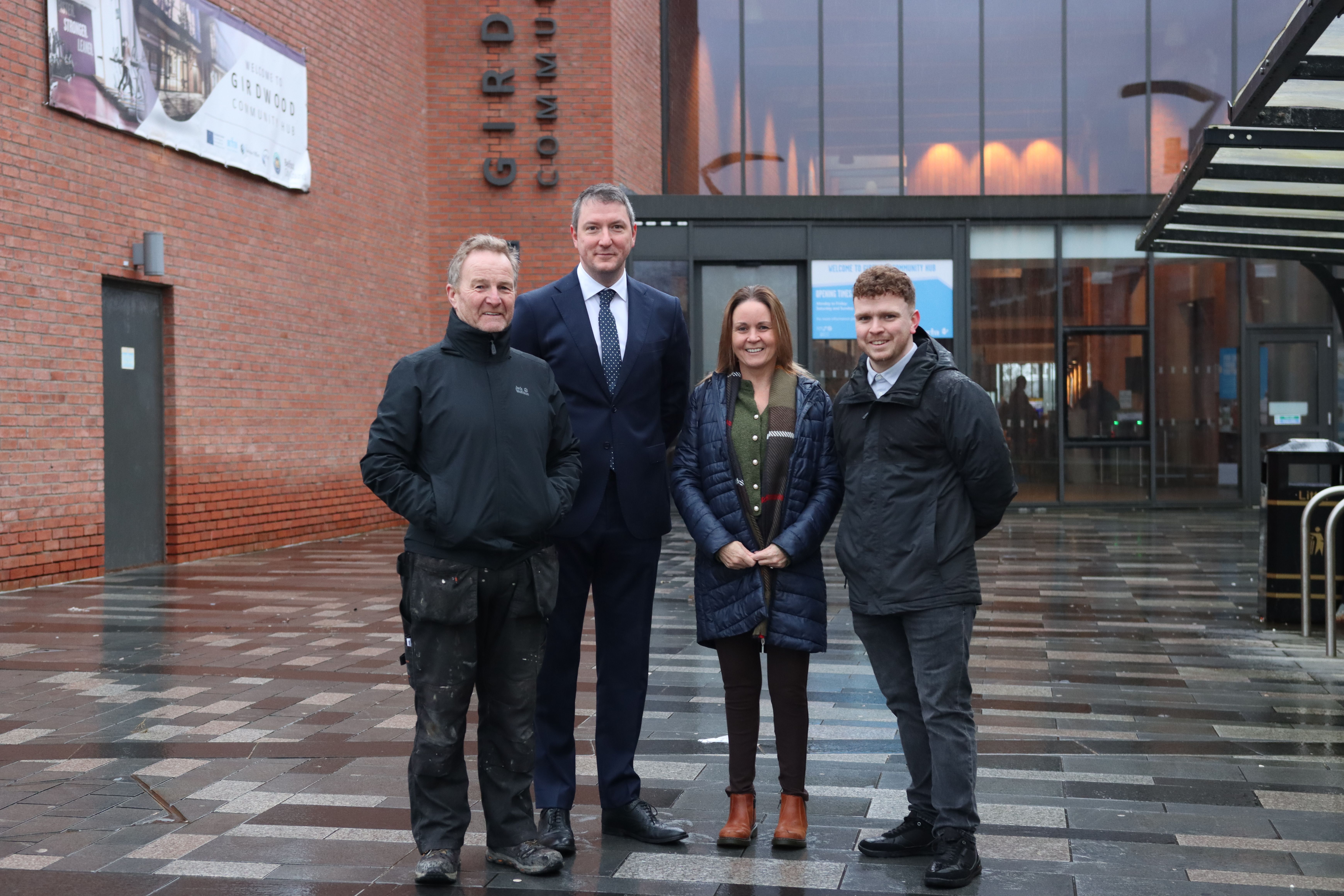 INVESTMENT: Councillor JJ Magee, John Finucane MP, Councillor Nichola Bradley and Councillor Ryan Murphy outside Girdwood Community Hub