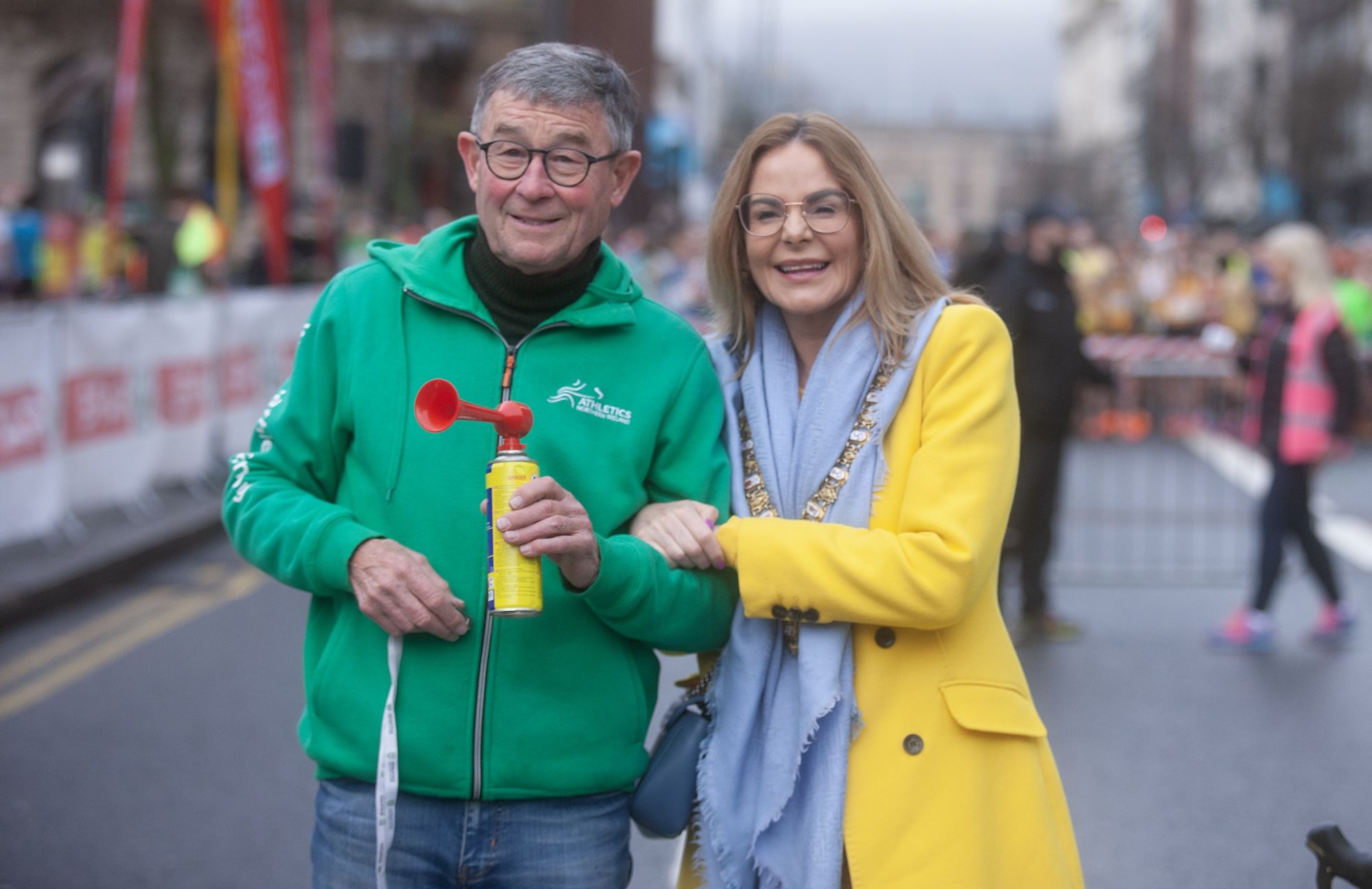 OUT OF THE BLOCKS: Davie Seaton ready to sound the horn for the start of the 2023 SPAR Craic 10K with First Citizen Tina Black