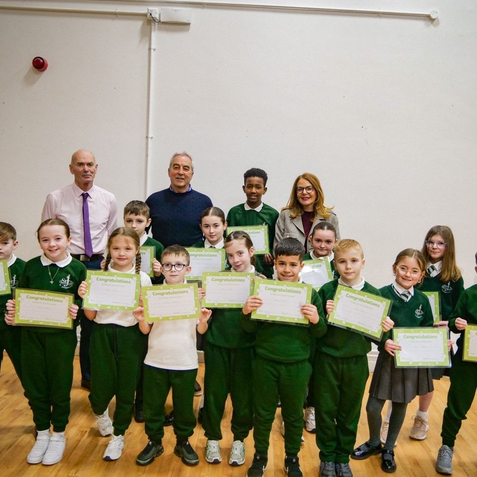 SCHOOL DEMOCRACY: Pat Sheehan MLA and Councillor Tina Black with staff and pupils at St Joseph\'s Primary School