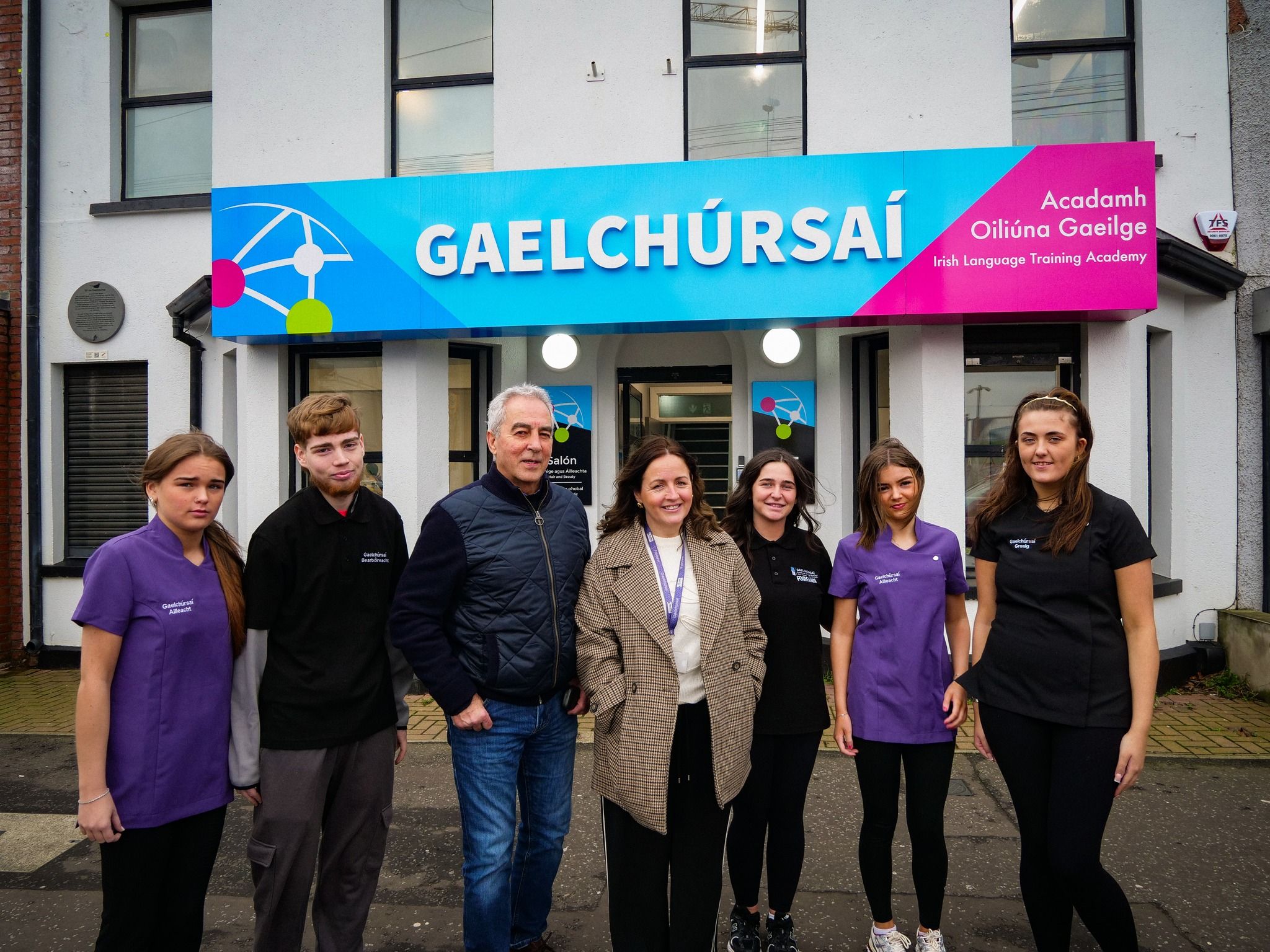 PRAISE: West Belfast MLA Pat Sheehan with staff and students from Gaelchúrsaí on the Falls Road