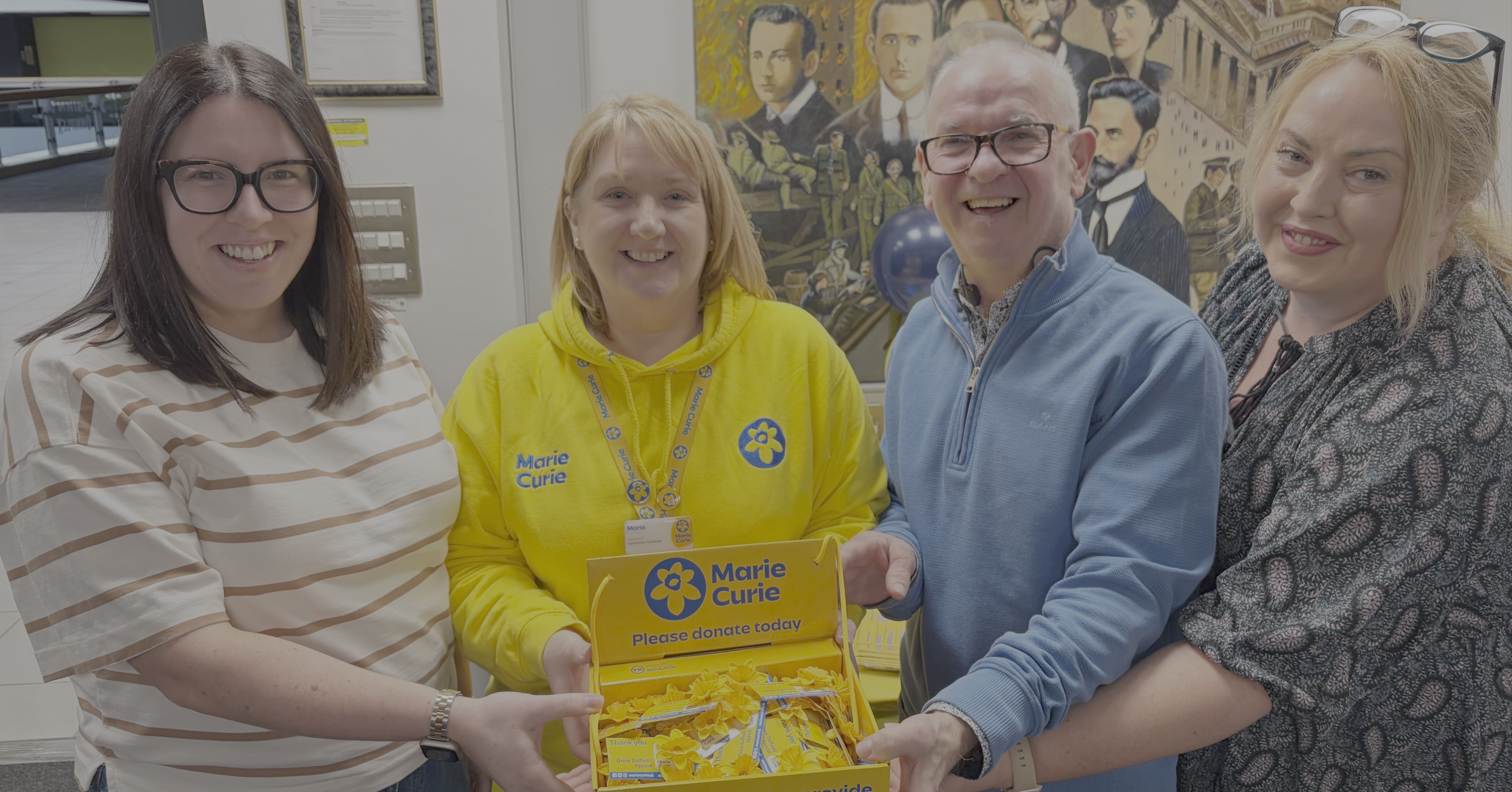 \'COMMUNITY SPIRIT\': Bronagh Bradley of John Finucane Solicitors, Marie Harris of Marie Curie, Eugene McGurk of Direct Furniture and Tierna Cunningham of John Finucane Solicitors supporting the coffee morning fundraiser