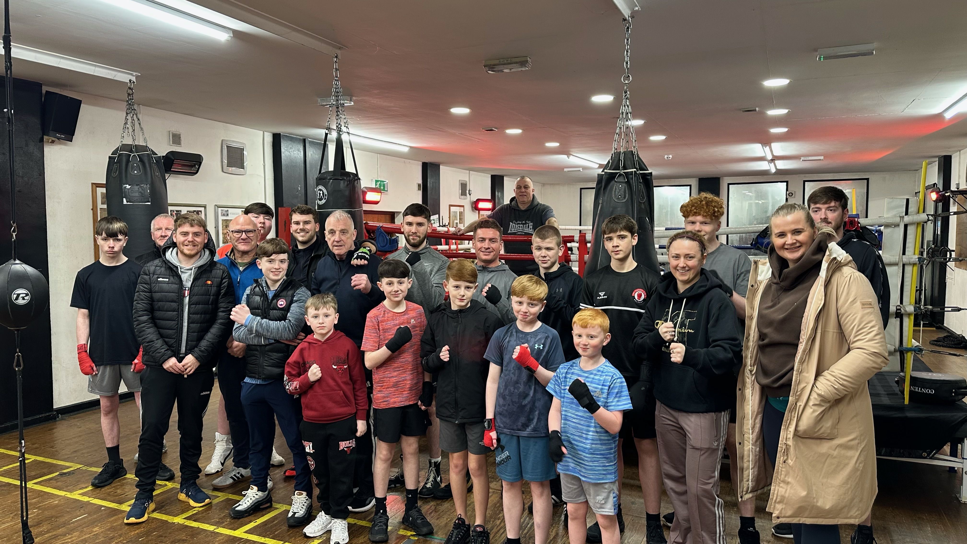 PRAISE: Aisling Reilly MLA with the team at St Agnes\' Boxing Club