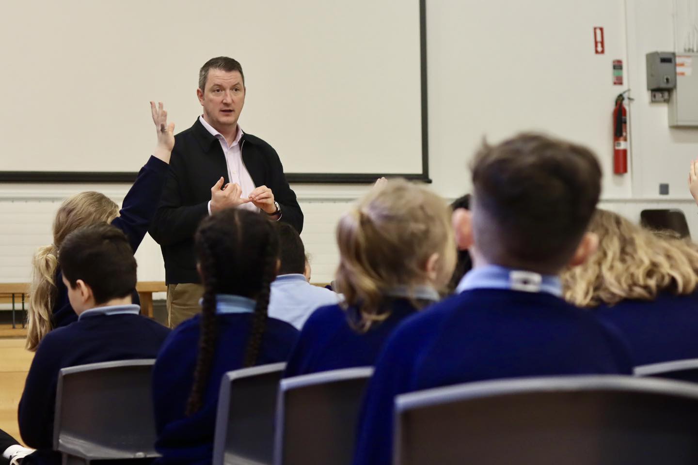 DEMOCRACY IN ACTION: John Finucane MP speaking to pupils at St Mary’s Star of the Sea Primary School 