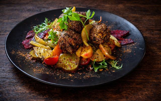 PLATING UP: Pork meatballs with caramelised apple and beetroot salad