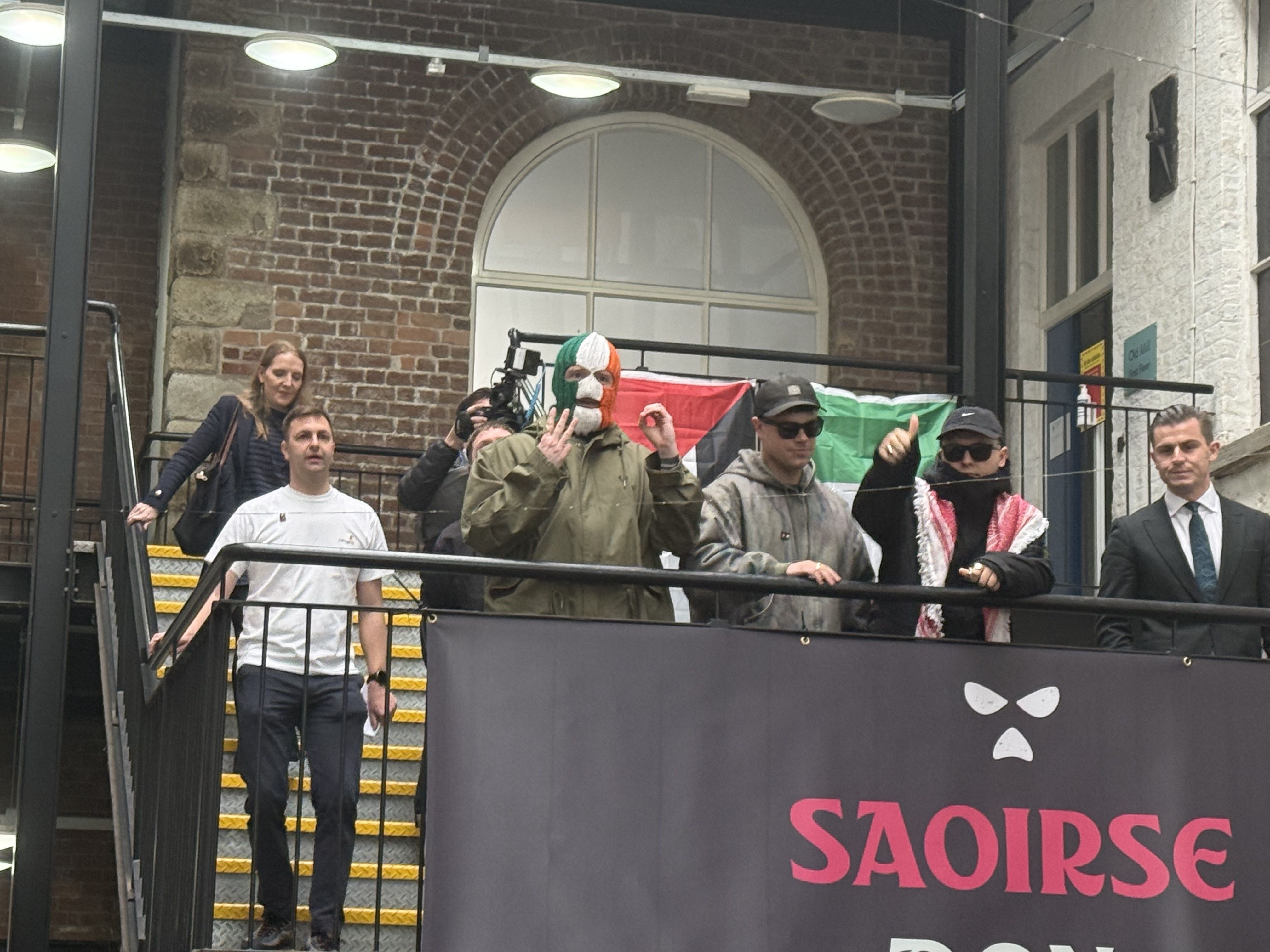 THUMBS UP: Kneecap member Mo Chara arrives at a press conference at Conway Mill on Wednesday afternoon