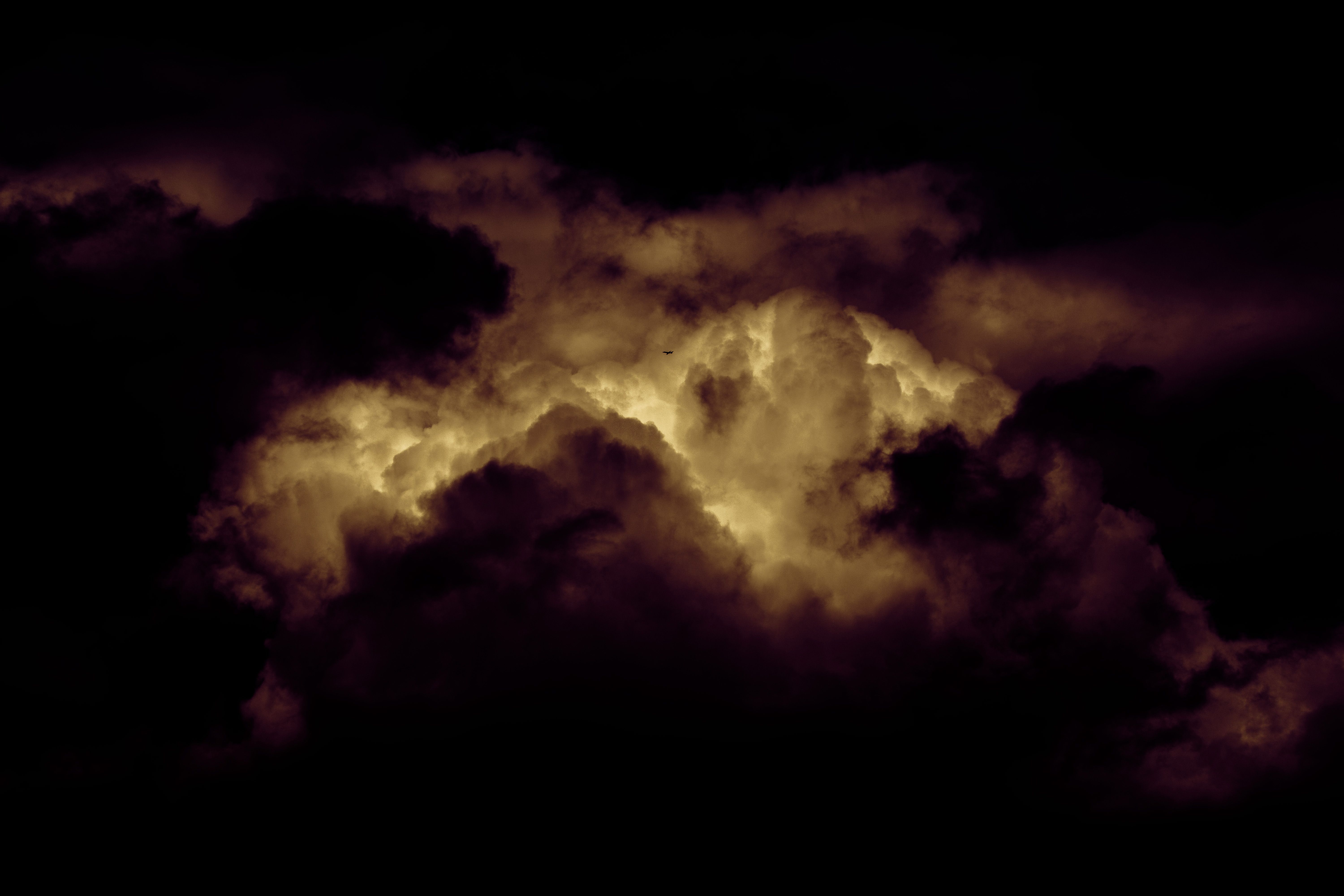 Silent Redux, a photograph of a jet airplane dwarfed within an enormous cloudscape high above Cave Hill Belfast by photographer Stephen S T Bradley