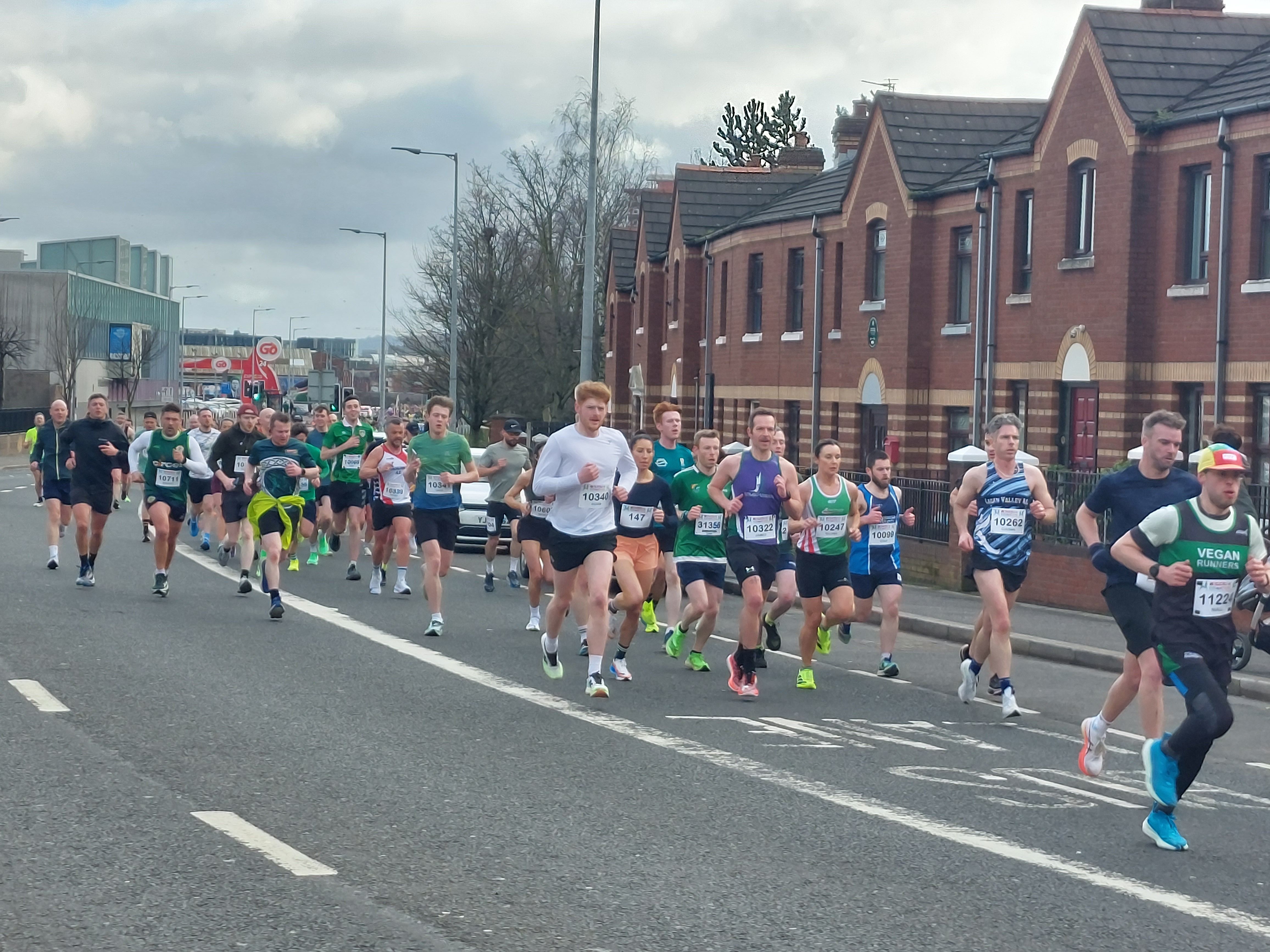 GREAT CRAIC: Runners on the Falls Road this morning