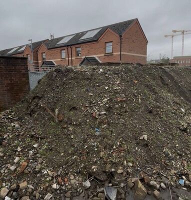 WATCH: Earthmoving operation can’t stop Westlink asbestos bonfire