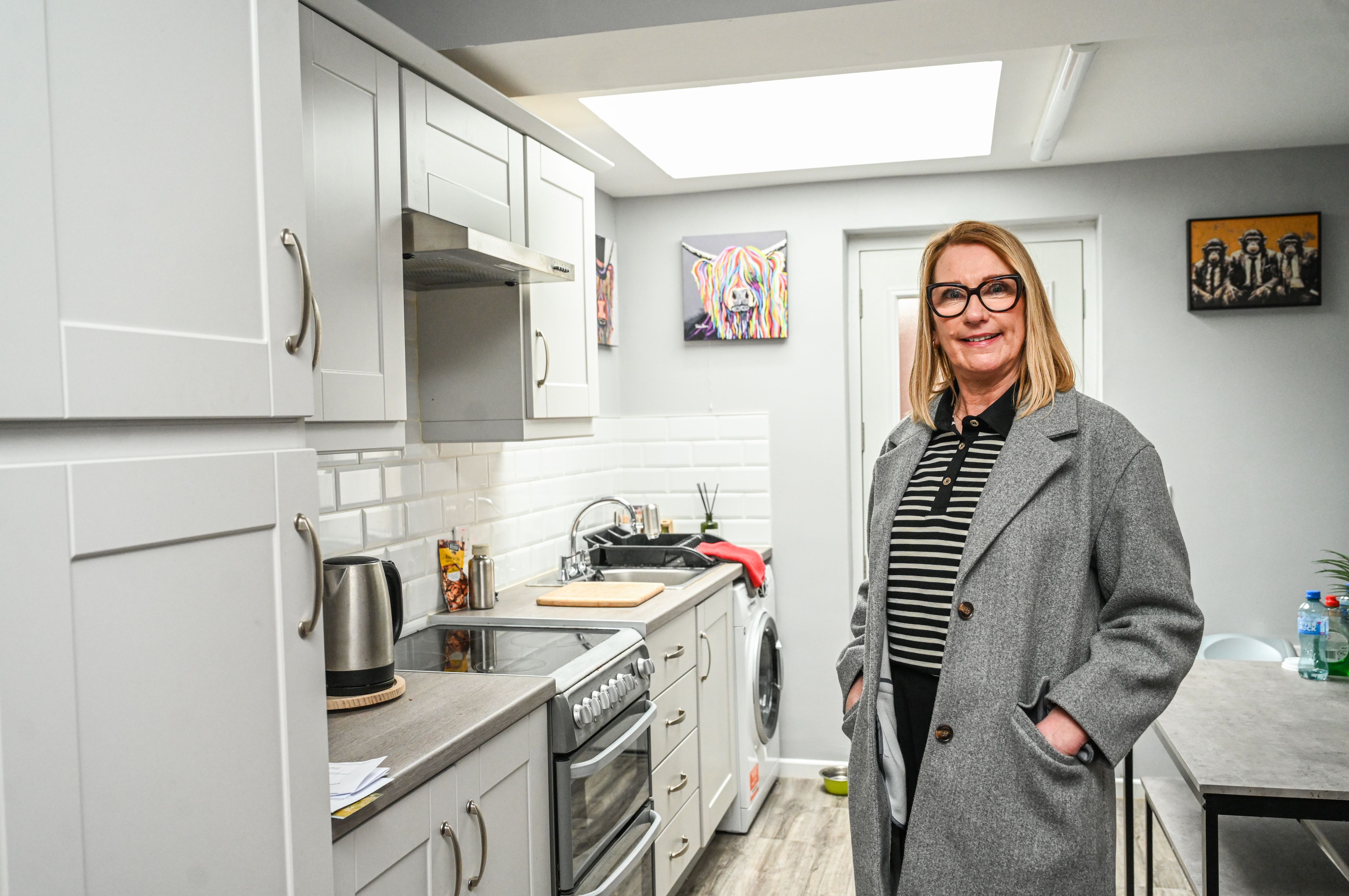 EXTENSIONS: Housing Executive Patch Manager Heather McLarnon sees the finished result in one tenant’s new kitchen