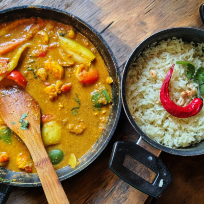 PLATING UP: Prawn and Cashew Satay with ripped basil leaves