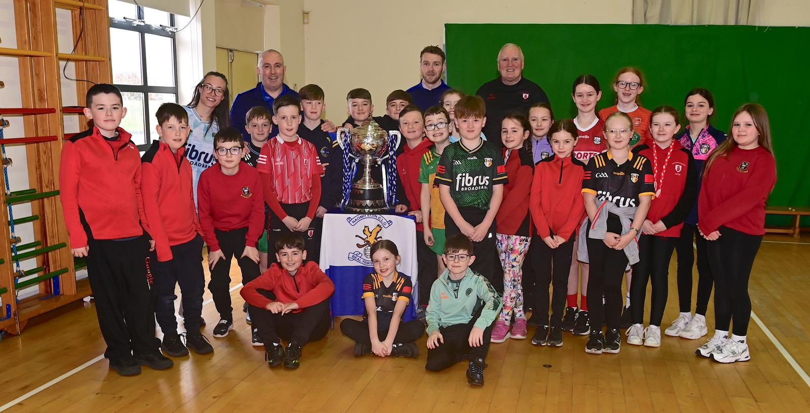 SILVERWARE: Pupils of Ballymacward Primary School with the Volunteer Cup