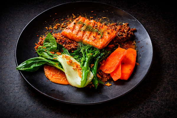 PLATING UP: Grilled salmon with bok choi carrots, tender stem broccoli