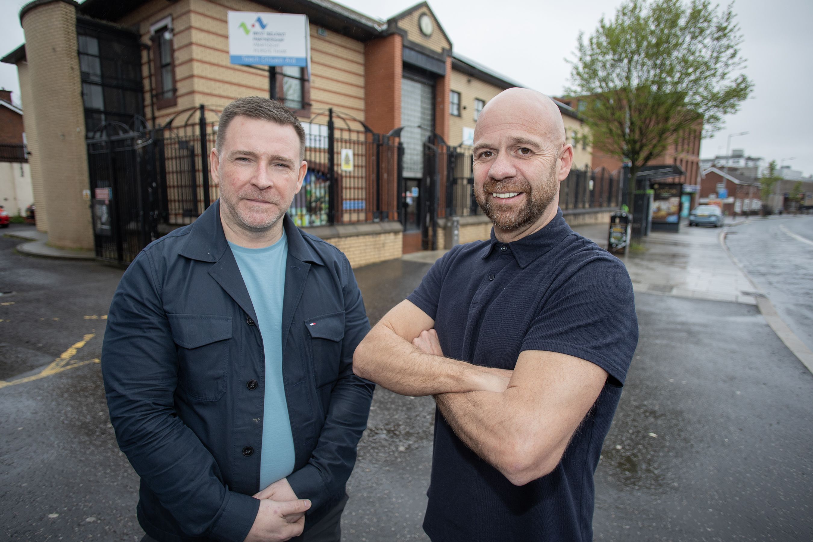 GOING GREEN: Terry Quinn and Joe Duffy from West Belfast Partnership Board outside Teach Chluain Ard on the Falls Road