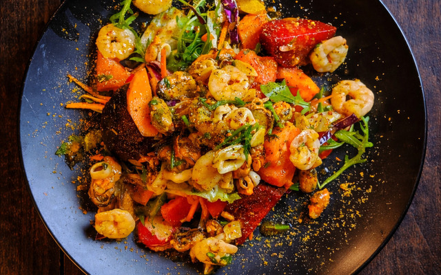 PLATING UP: Prawn and mussel salad with a curry powder sprinkle