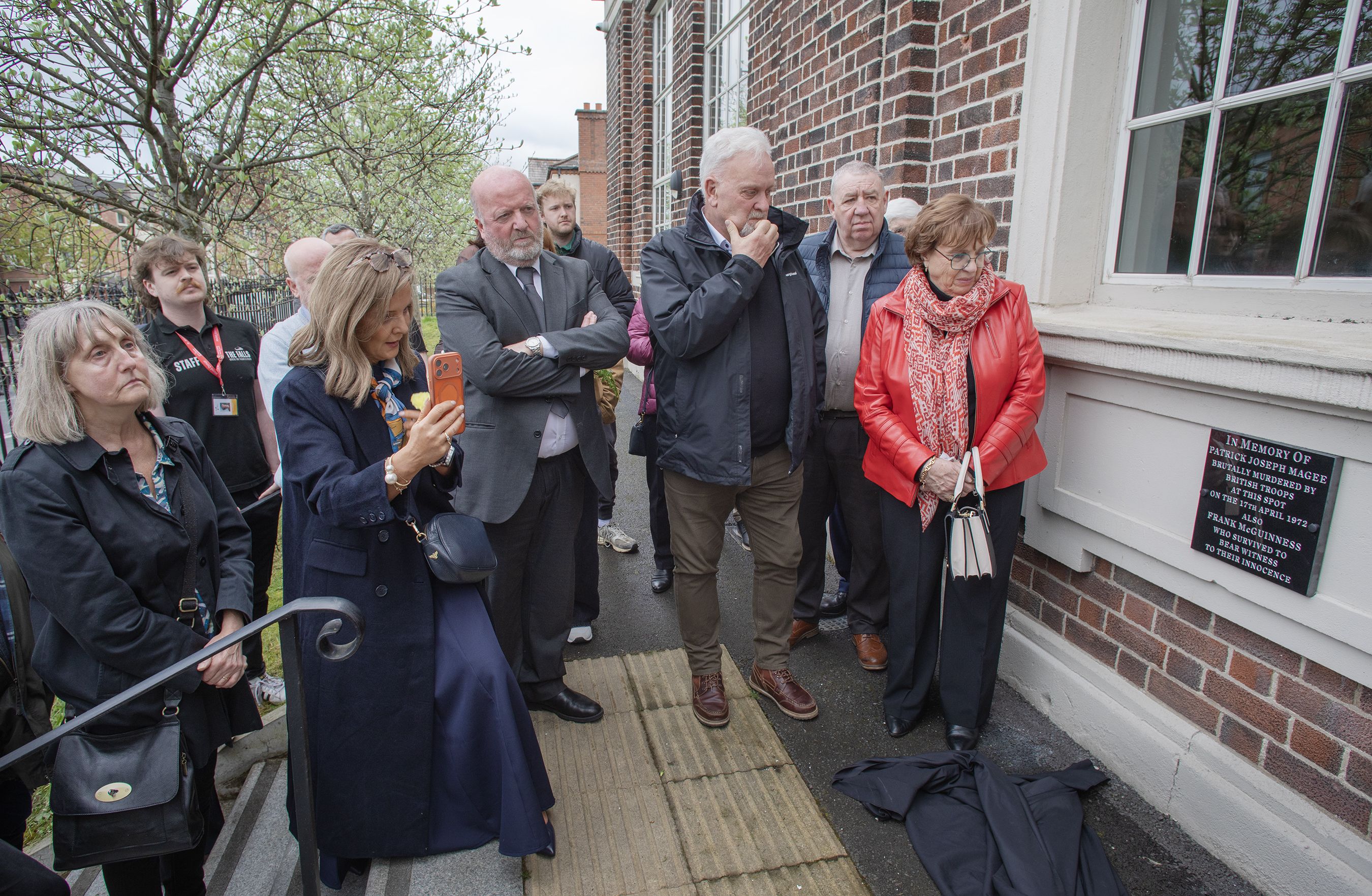 EMOTIONAL: Patrick Magee\'s family at the plaque unveiling to the student teacher who was murdered by the British Army on Divis Street 54 years ago