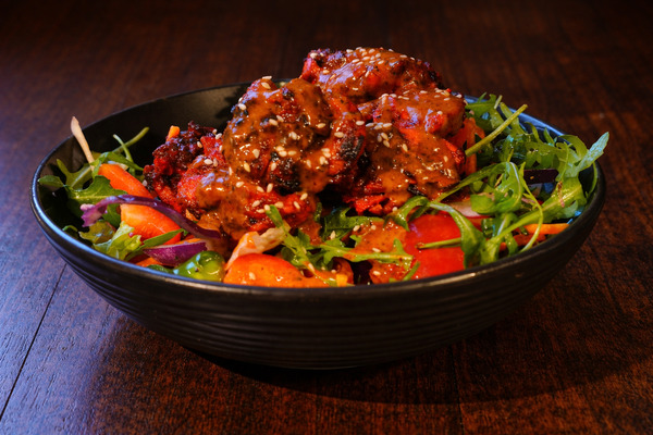 PLATING UP: Tandoori chicken with creamy coconut sauce and green salad