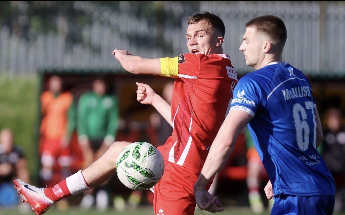 MY BALL: Captain Ronan Hale challenges for a ball in the midfield 